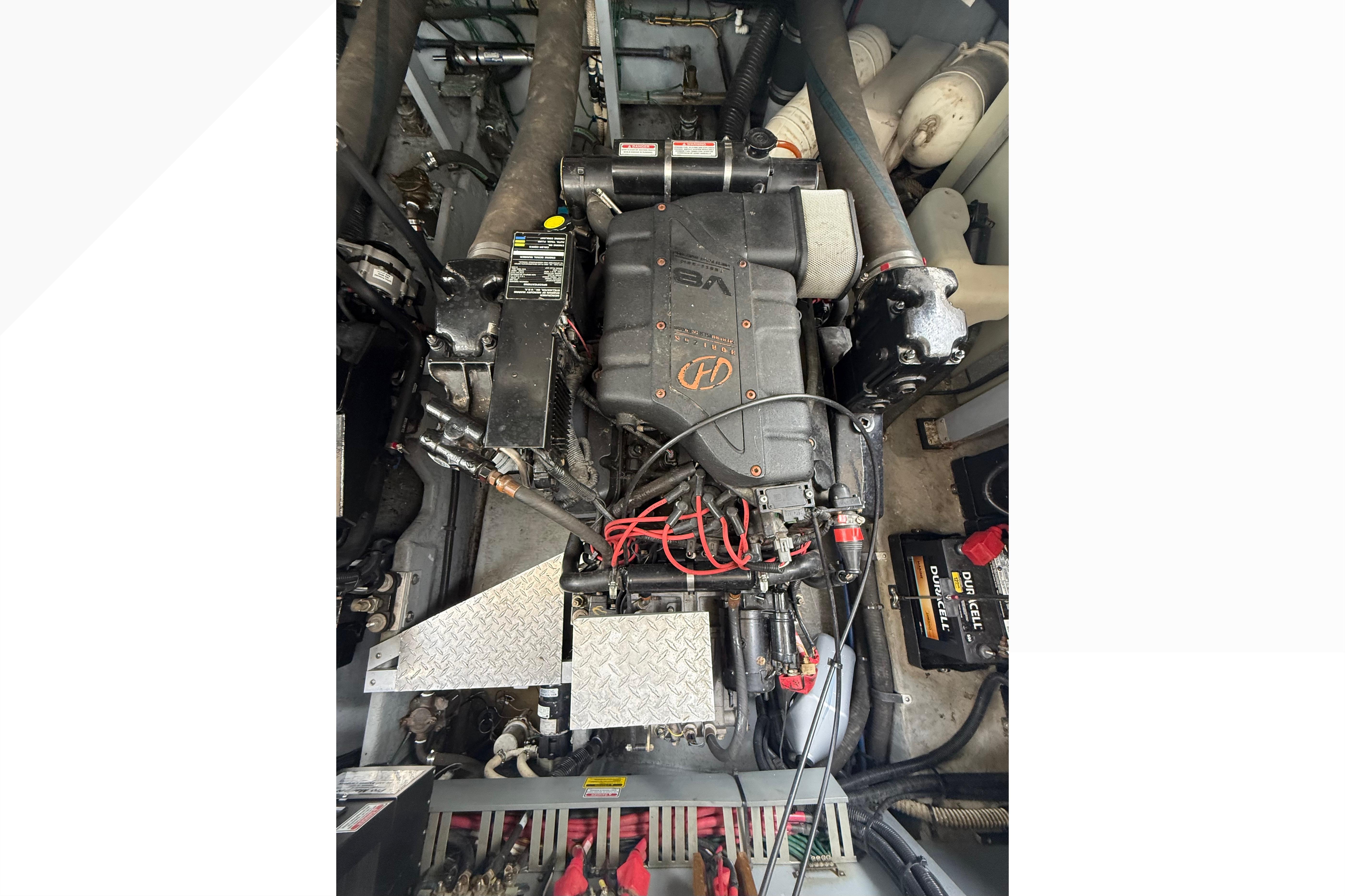 Engine compartment of a 1998 Sea Ray Sundancer 400 boat, featuring a V8 engine.