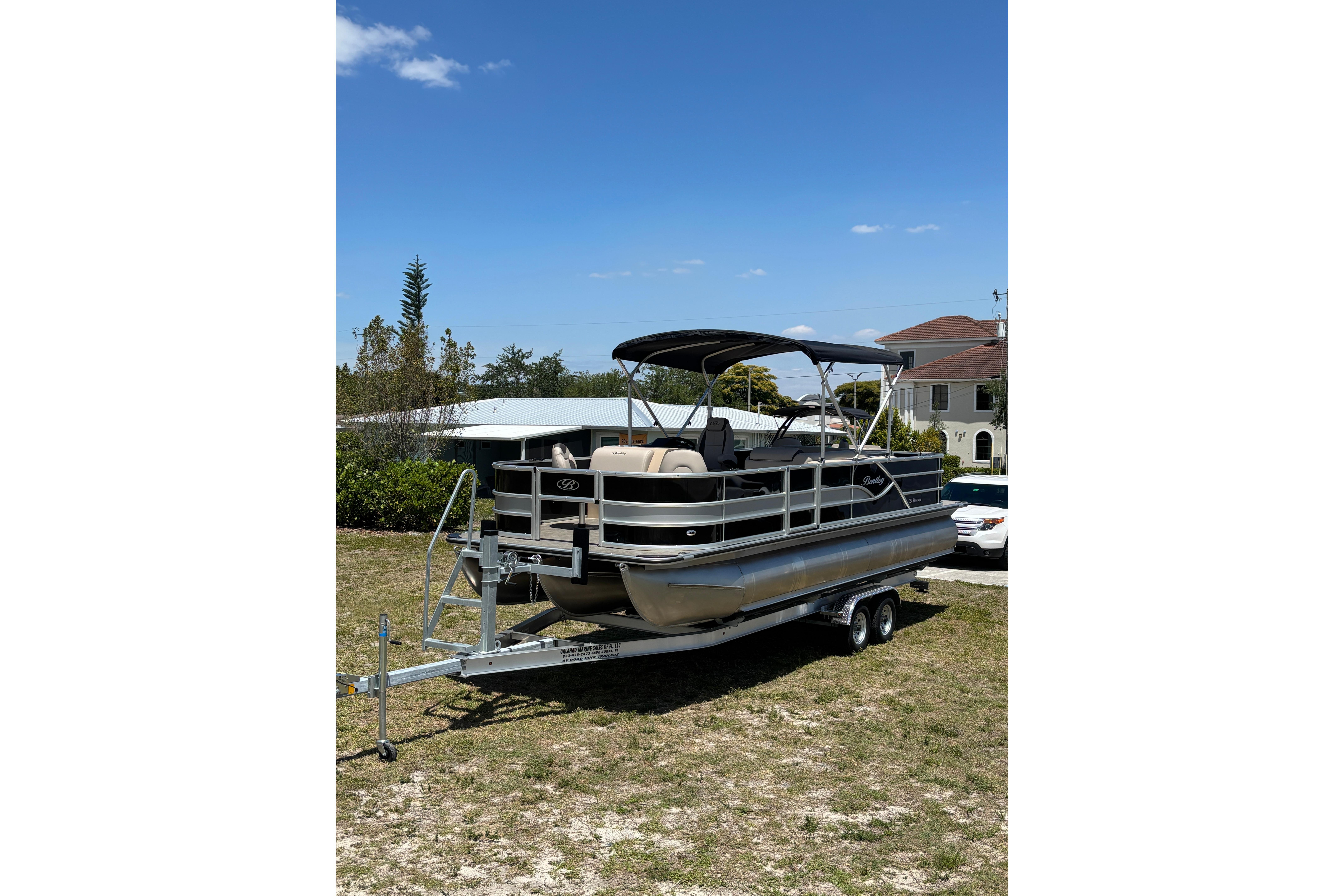 2026 Bentley Pontoons Fish 243 4-Point on trailer outdoors.