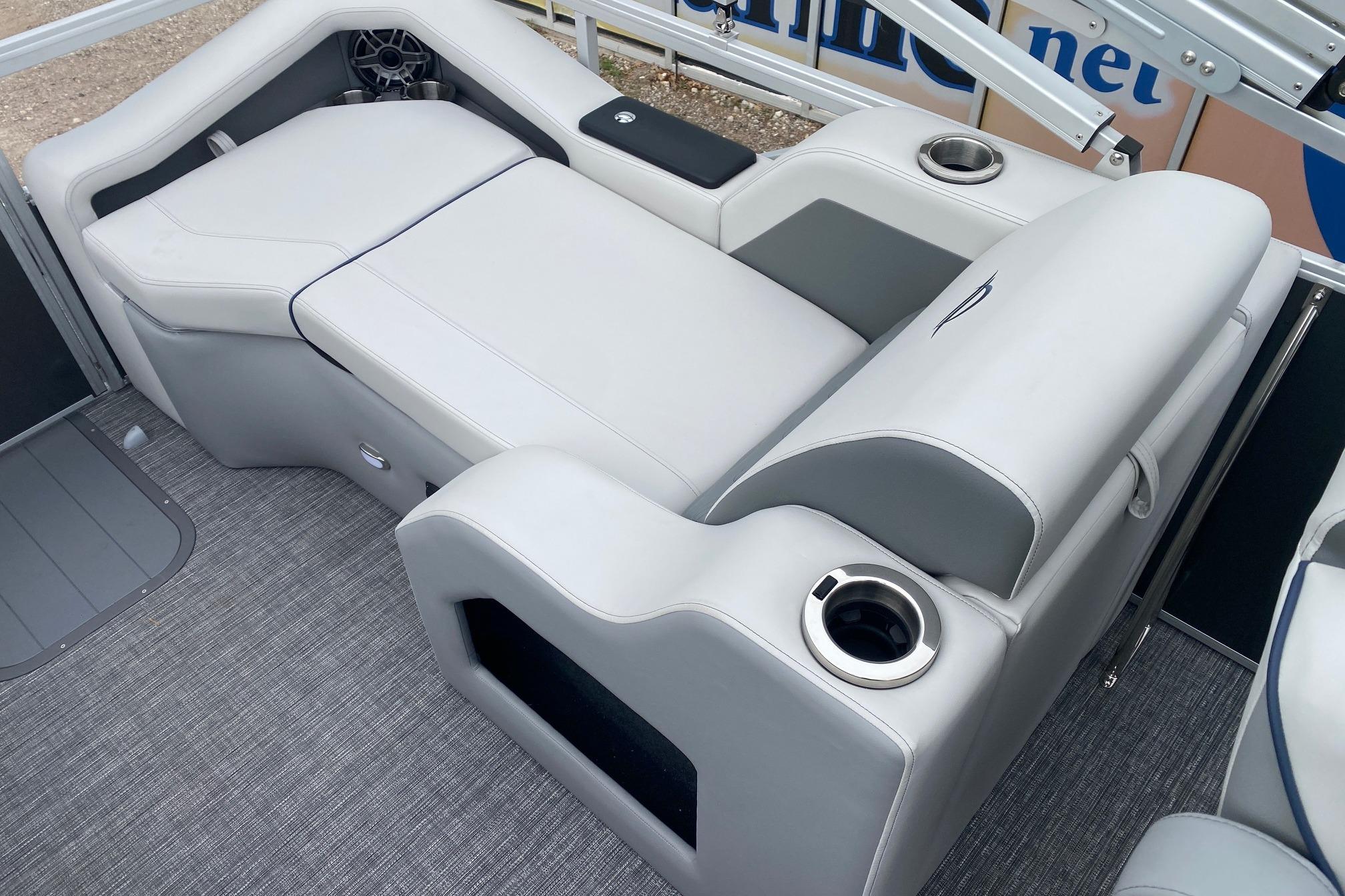 2026 SunCatcher Diamond Elite 324 SS boat interior with luxurious seating and cup holders.