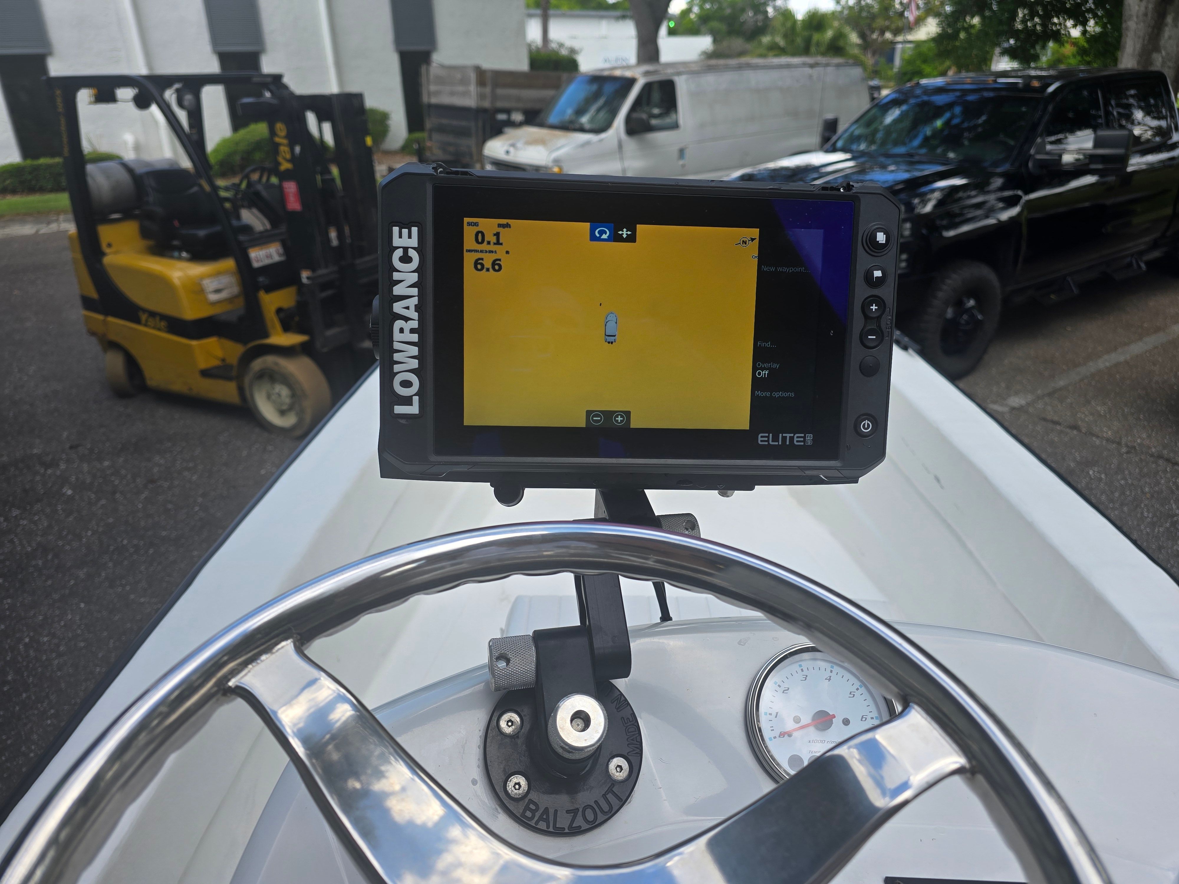 Lowrance GPS on Panga Eduardono 2022 boat, with forklift in background.