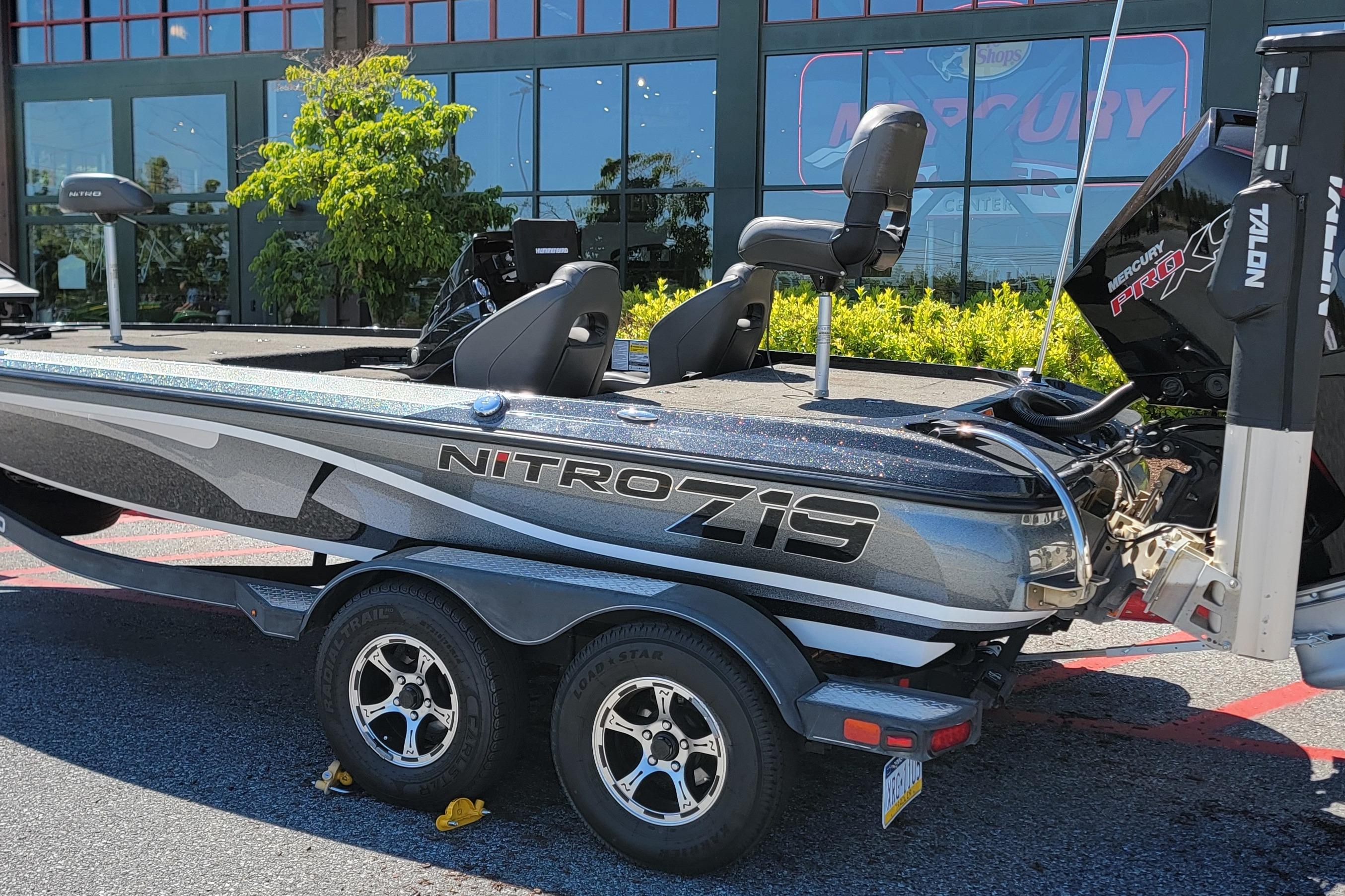 2020 Nitro Z19 Pro boat on trailer, parked outside a showroom.