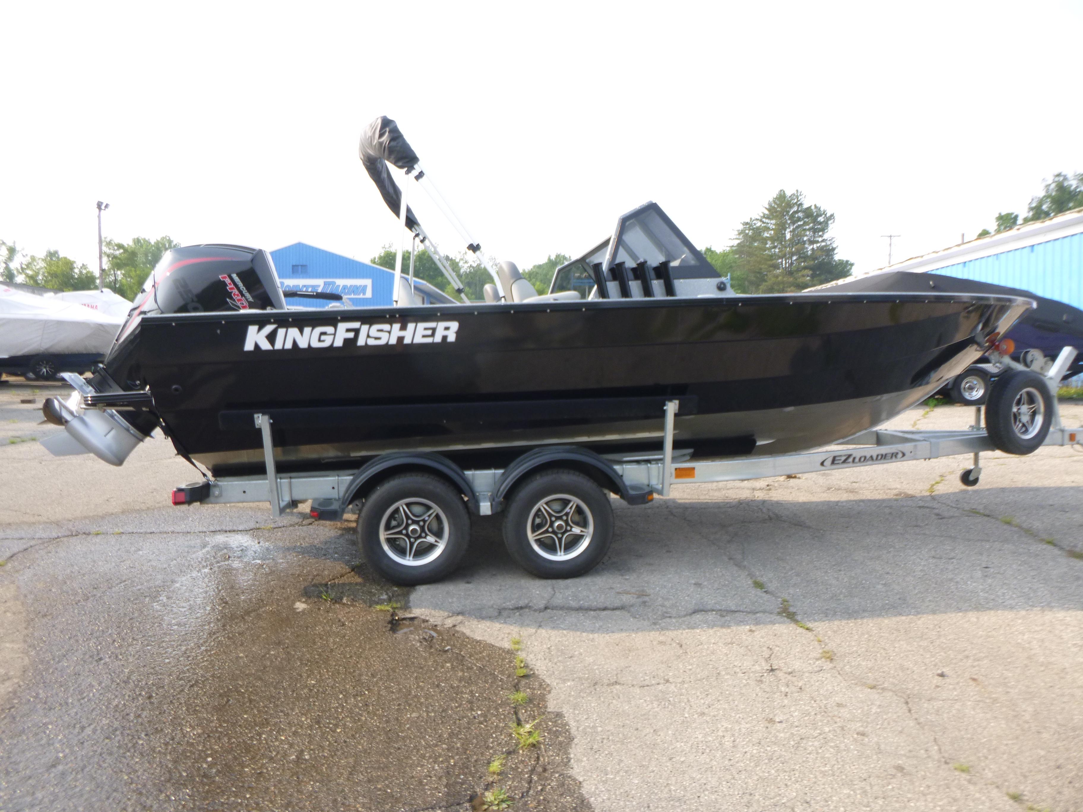 2025 KingFisher 2125 Arrow Sport boat on trailer, side view.
