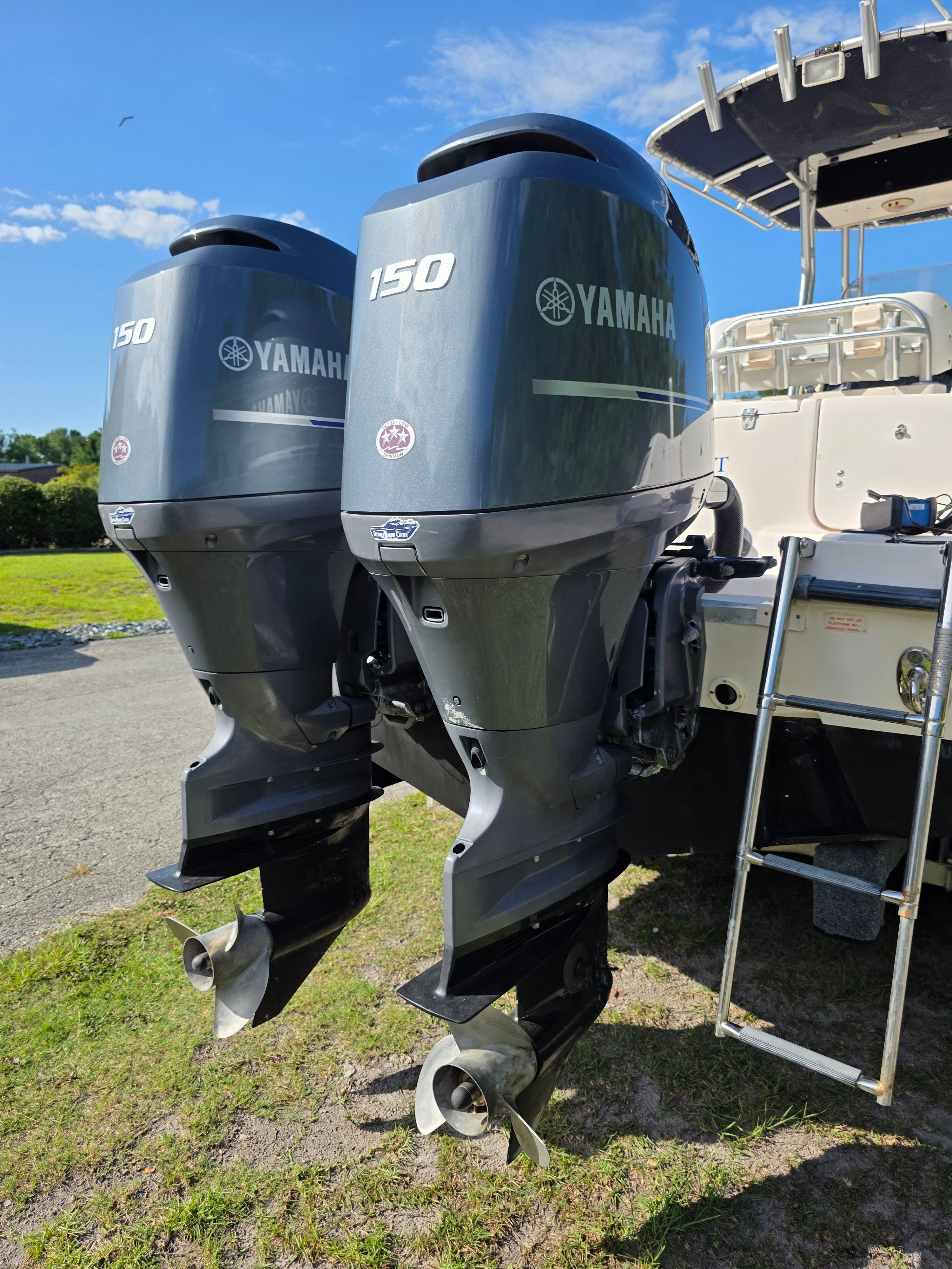 Two Yamaha outboard engines are mounted on the stern of a Grady-White 257 boat.