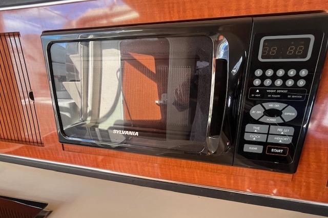 Sylvania microwave in 2003 Sea Ray 260 Sundancer boat kitchen interior.