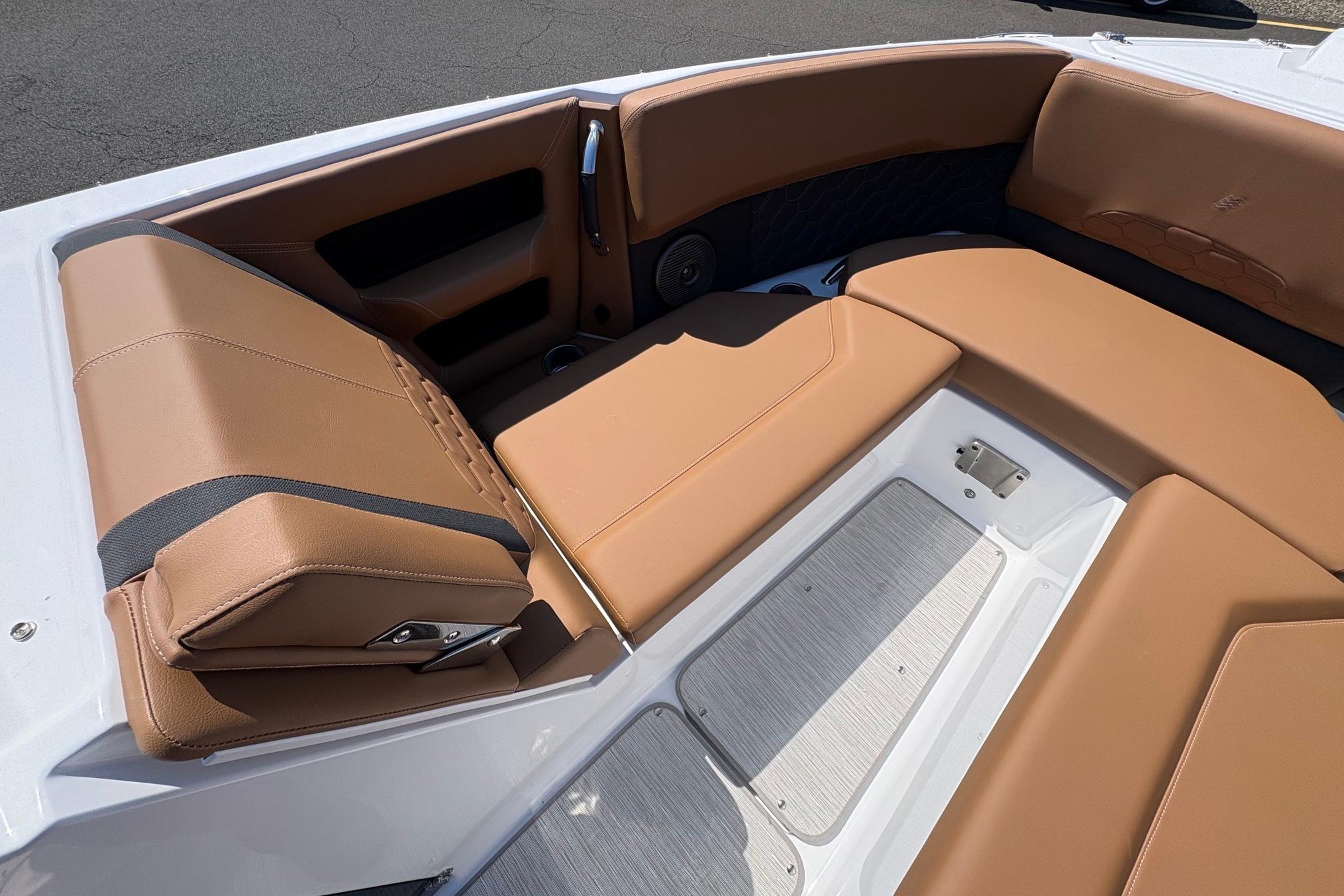 Luxurious tan seating in 2026 Four Winns H6 boat, showcasing premium interior design.