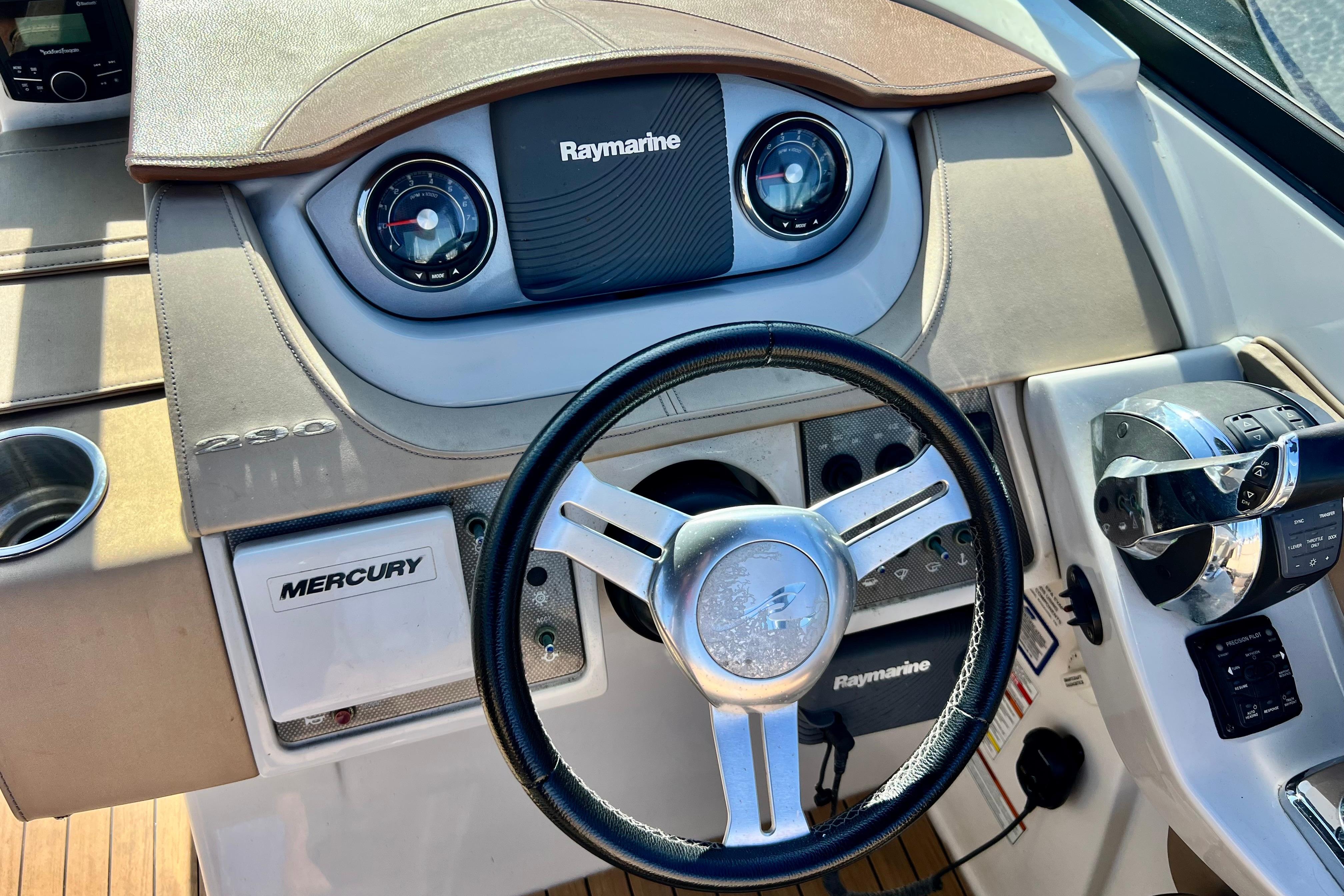 2016 Sea Ray 290 Sundeck Outboard dashboard with Raymarine electronics and Mercury controls.