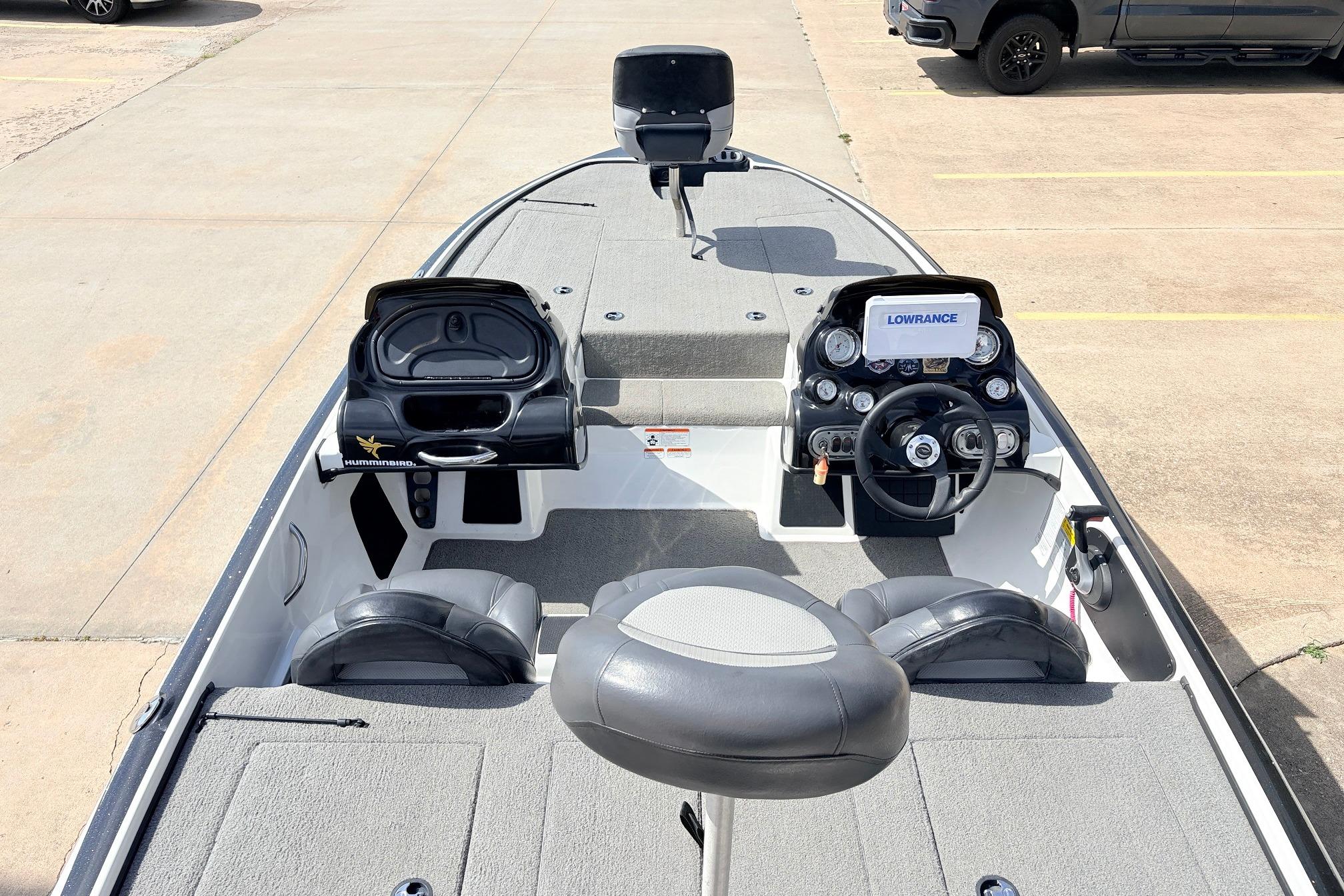 2011 Nitro Z-7 boat interior with steering console and fishing equipment.