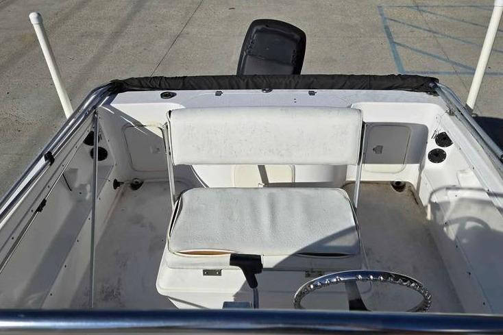 2001 Pro-Line 19 Sport boat interior with white seating and steering wheel.