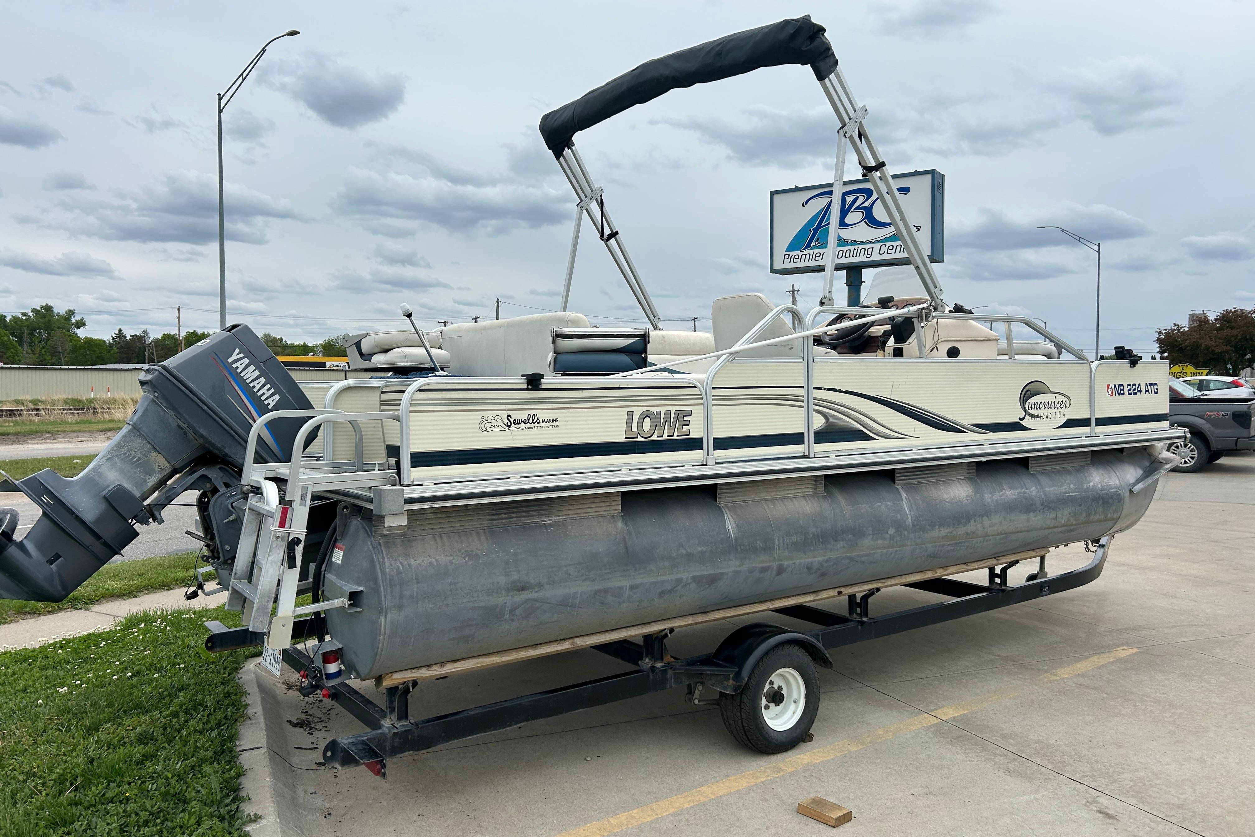 2002 Lowe Trinidad 200 pontoon boat with Yamaha motor on trailer.