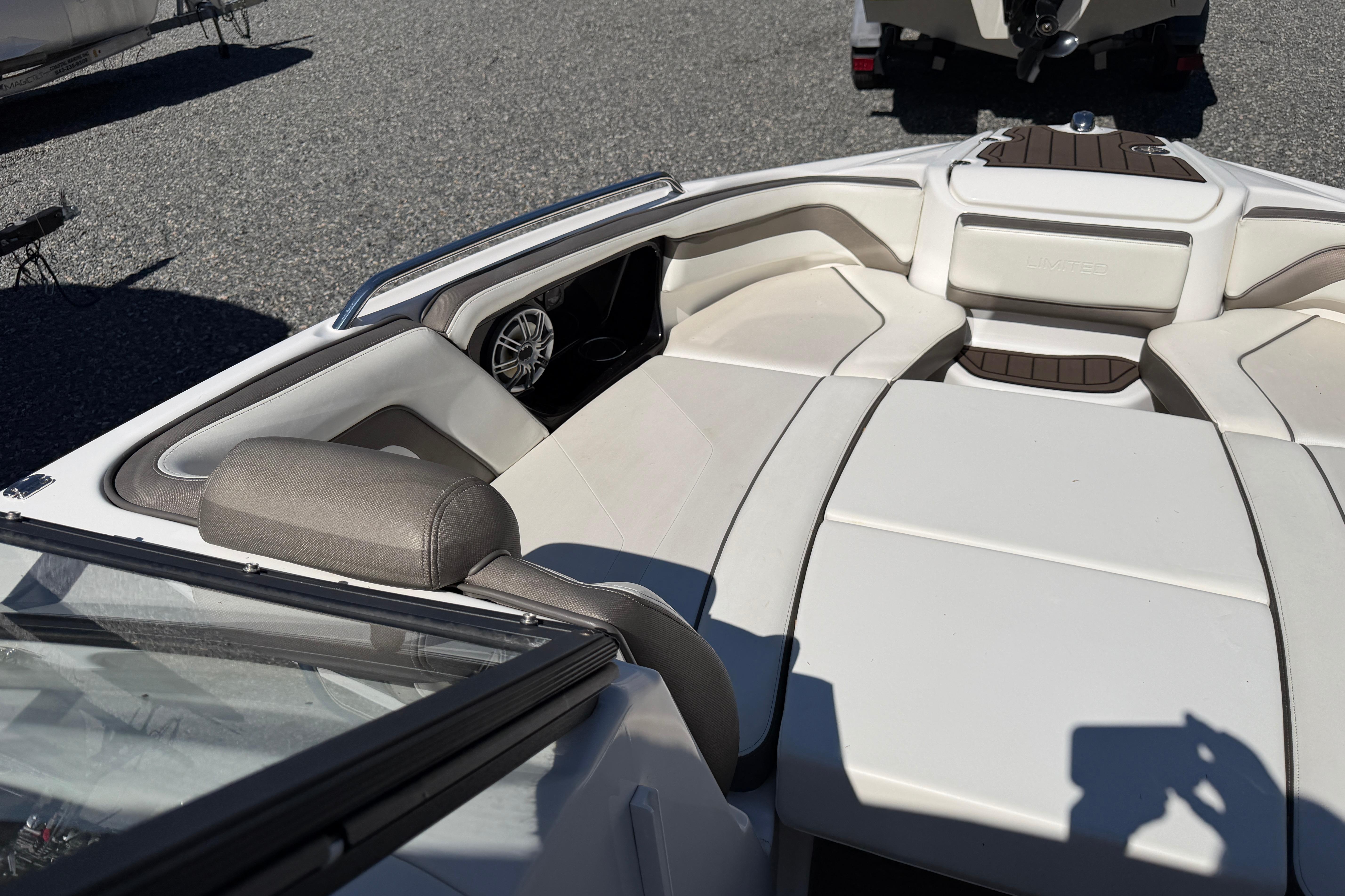 2016 Yamaha Boats 242 Limited S interior with white seating and speaker detail.