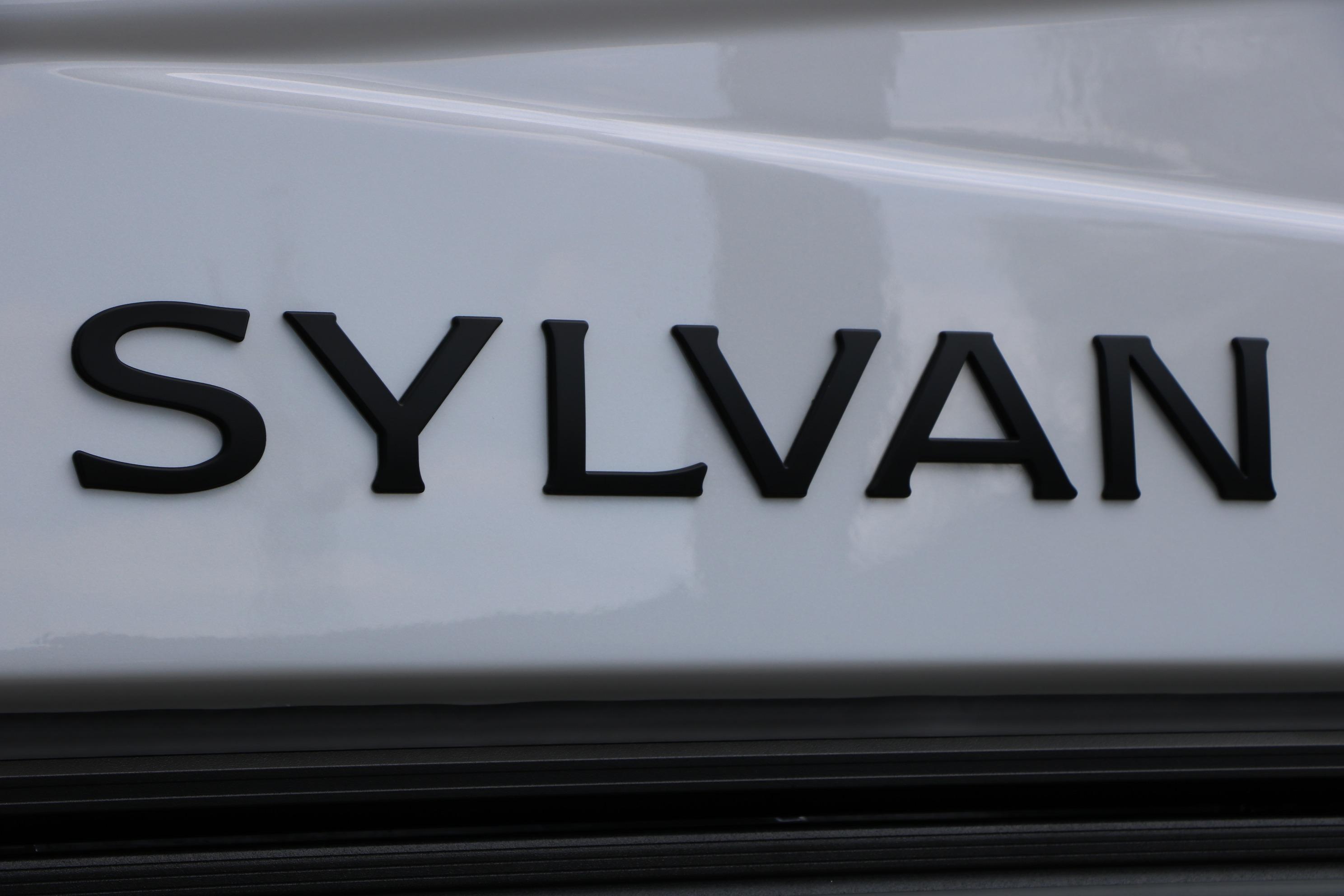 Sylvan logo on 2026 L3 DLZ Bar Platinum Edition Tri-Toon boat.