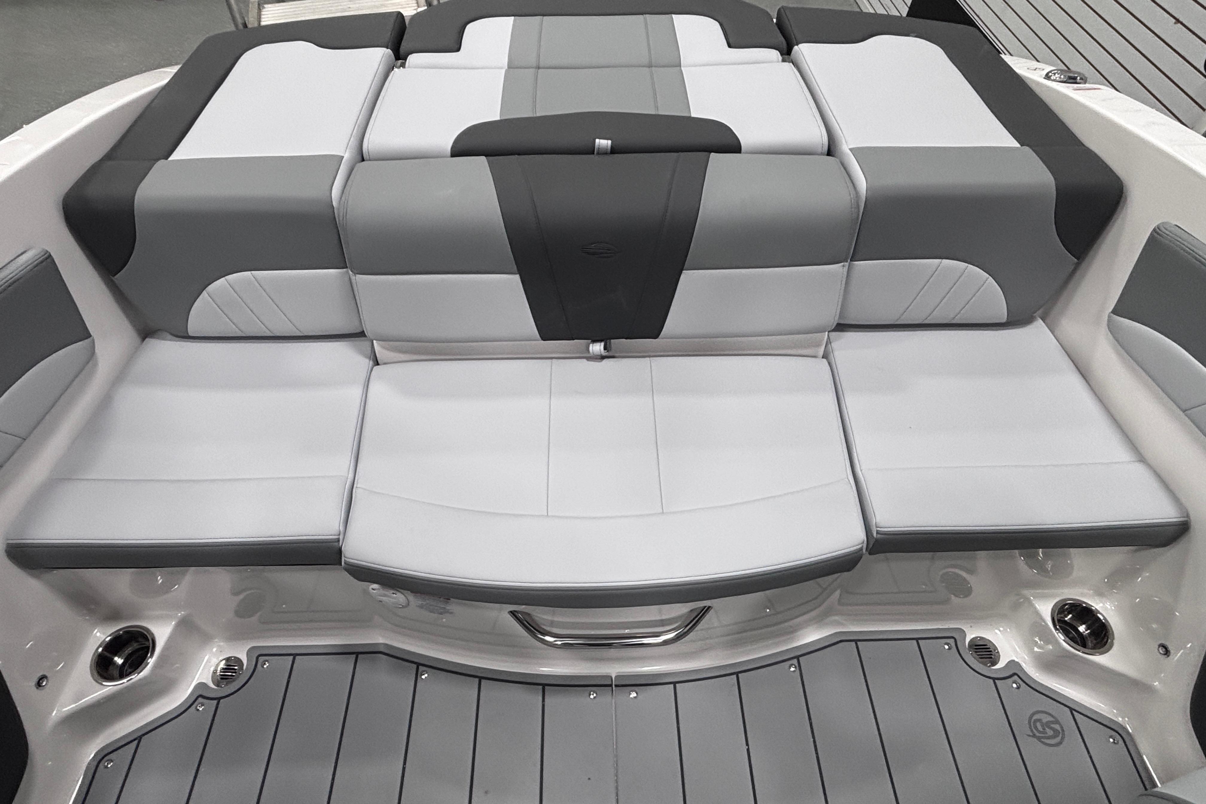 2026 Chaparral 21 SSi boat interior with gray and white cushioned seating.