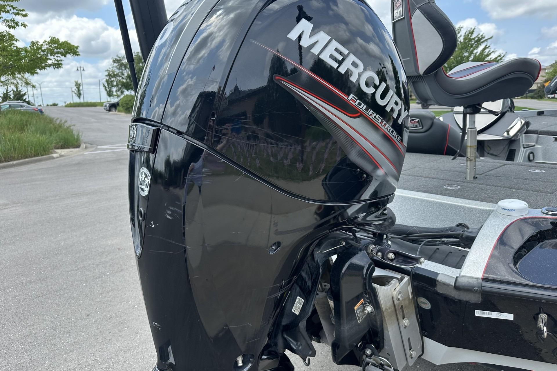 2018 Ranger Z518 boat with Mercury FourStroke engine in a parking lot.