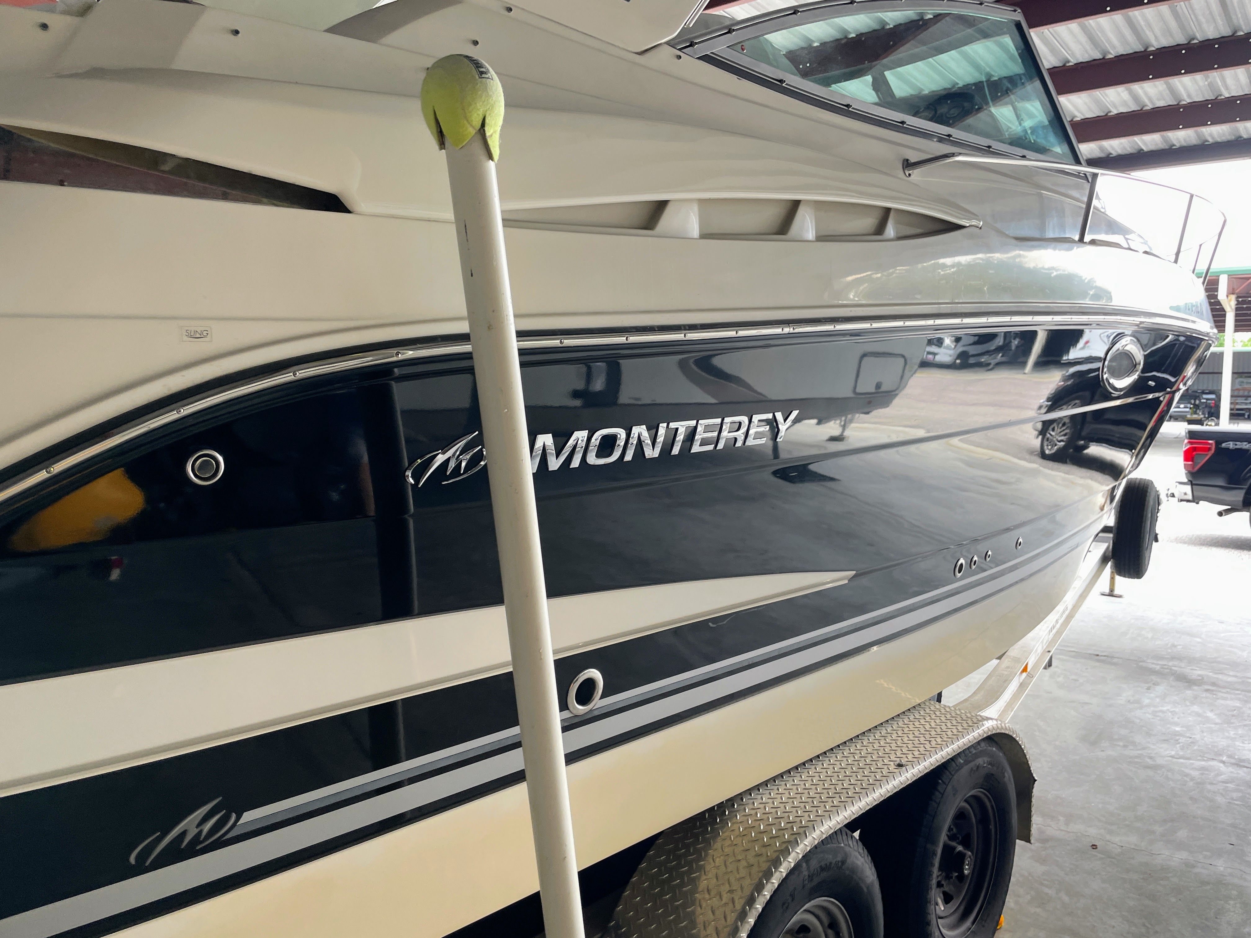 Monterey 280 Sport Cruiser 2010 on trailer in storage facility.