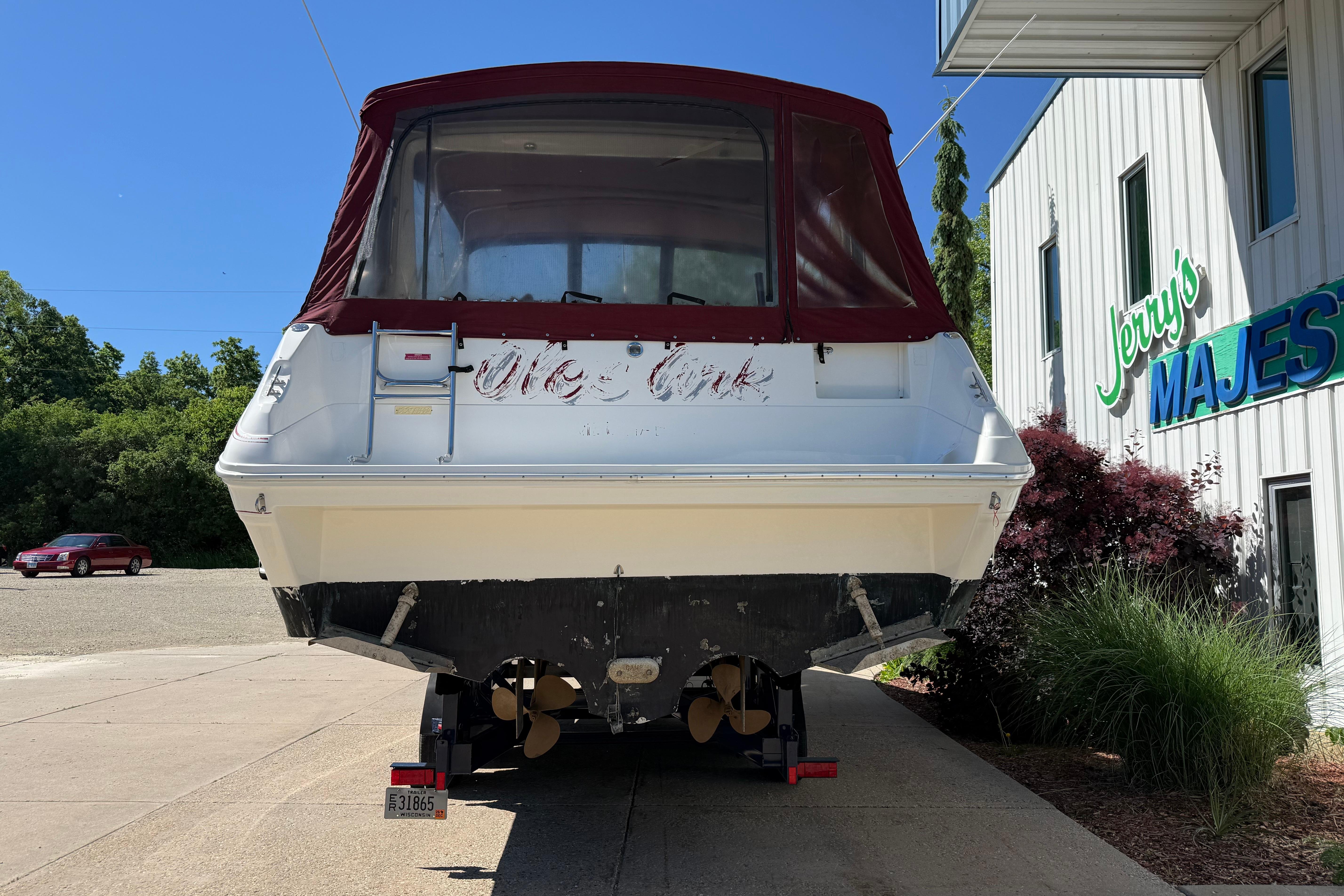 1990 Sea Ray 310 Express Cruiser on trailer outside Jerry's Majes building.