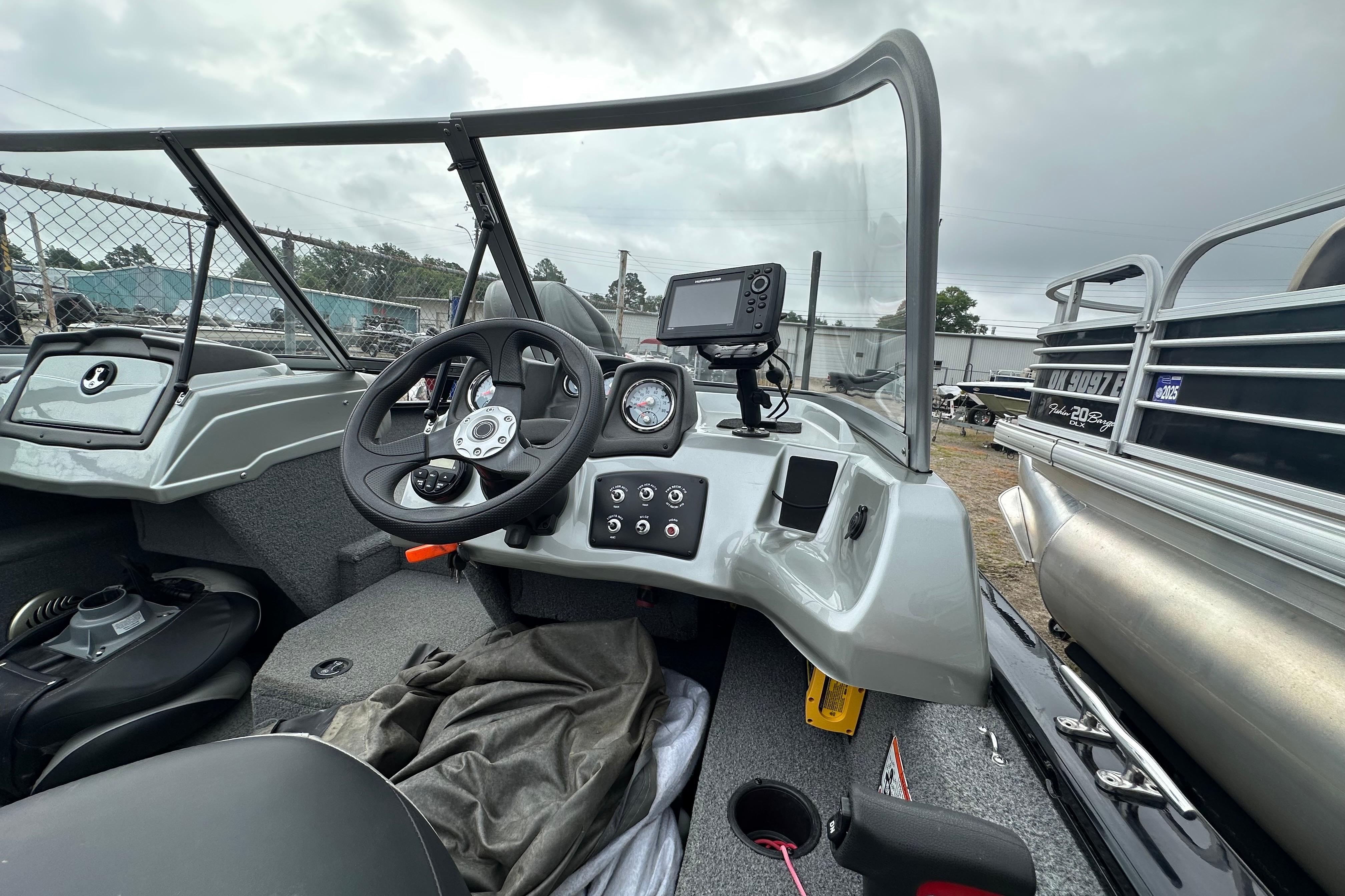 2018 Tracker Pro Guide V-175 Combo boat interior with steering wheel and control panel.