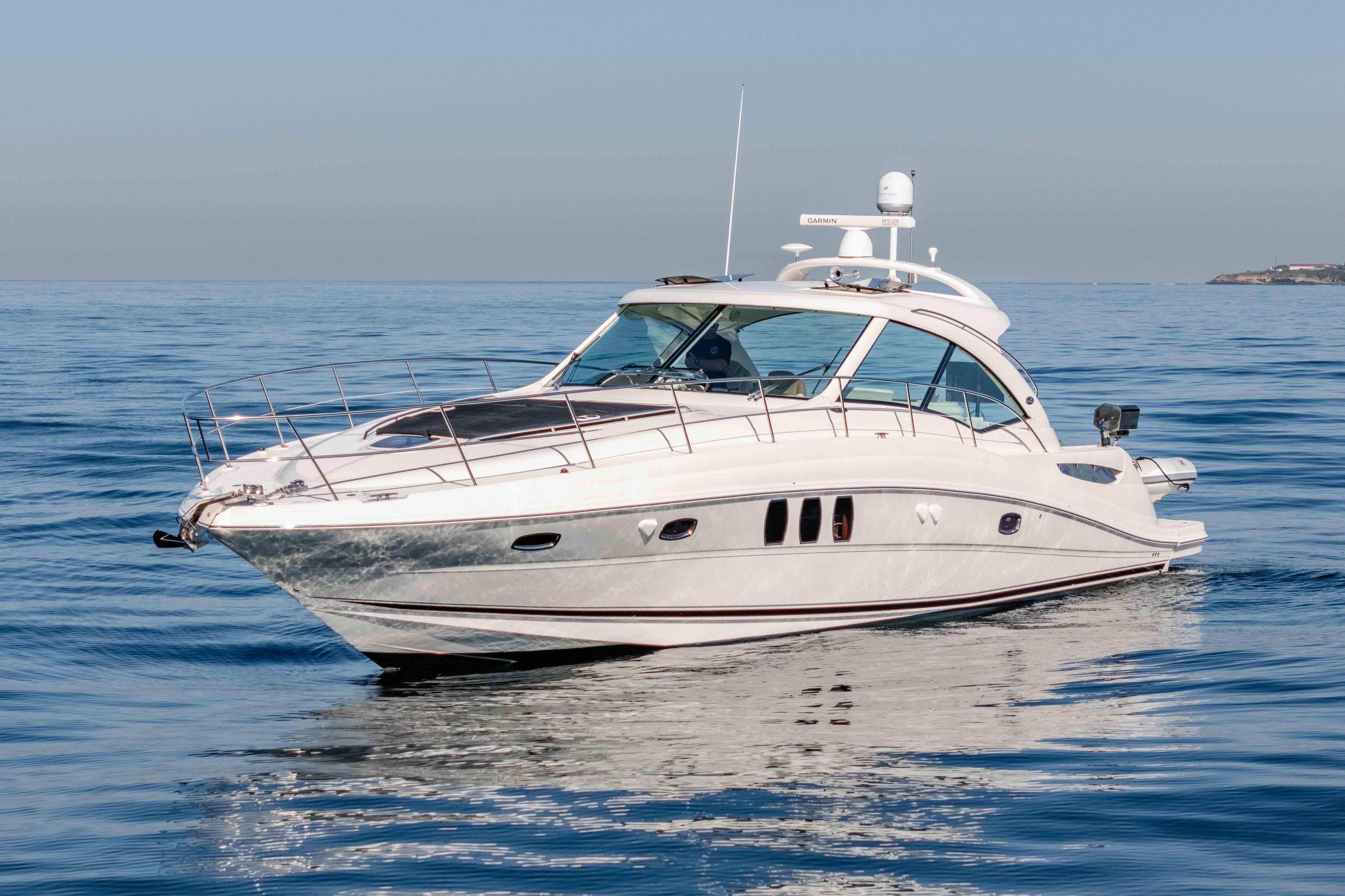 2007 Sea Ray 48 Sundancer yacht cruising on calm ocean waters.