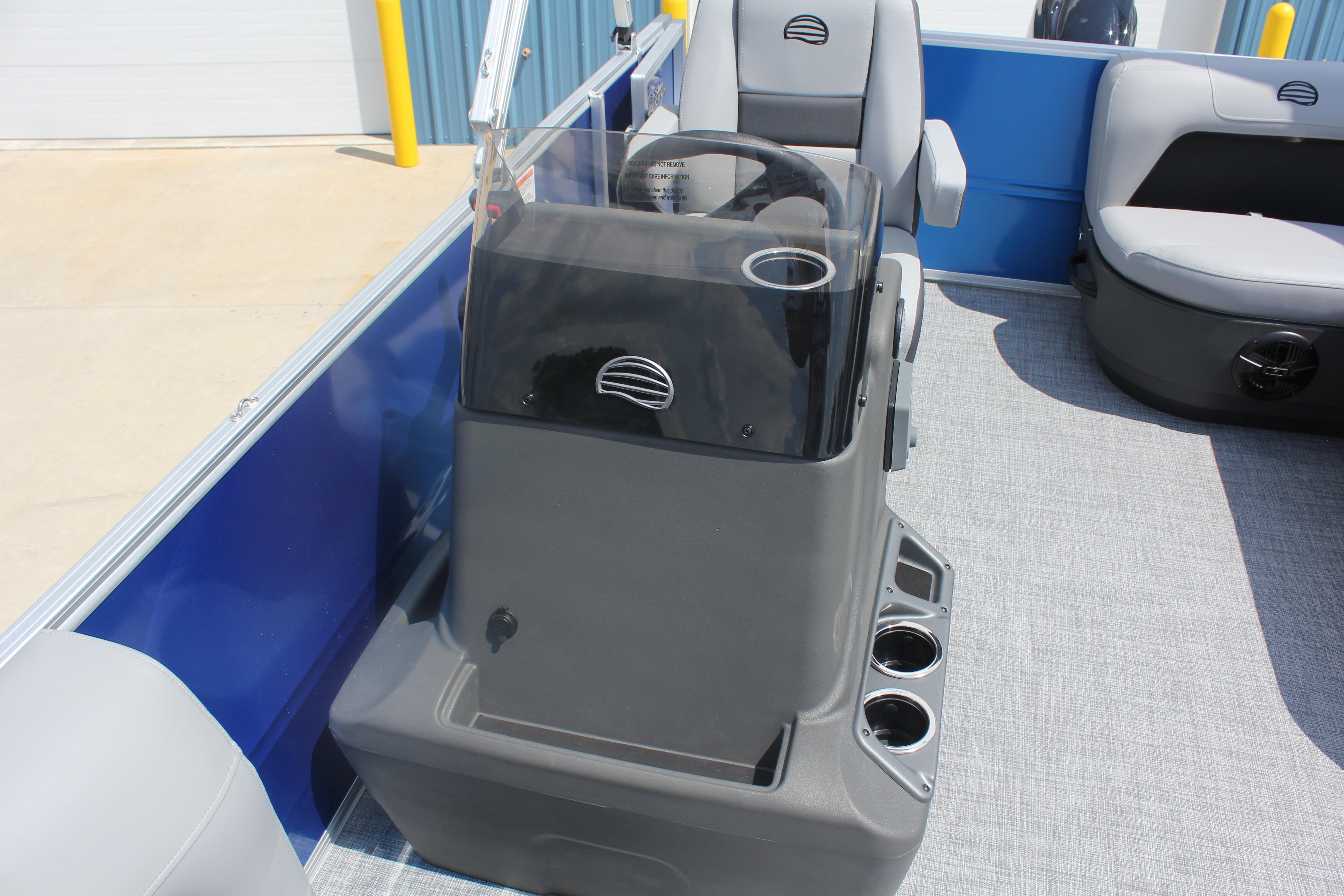 2026 Sun Tracker Party Barge 16 DLX interior with steering console and seating.