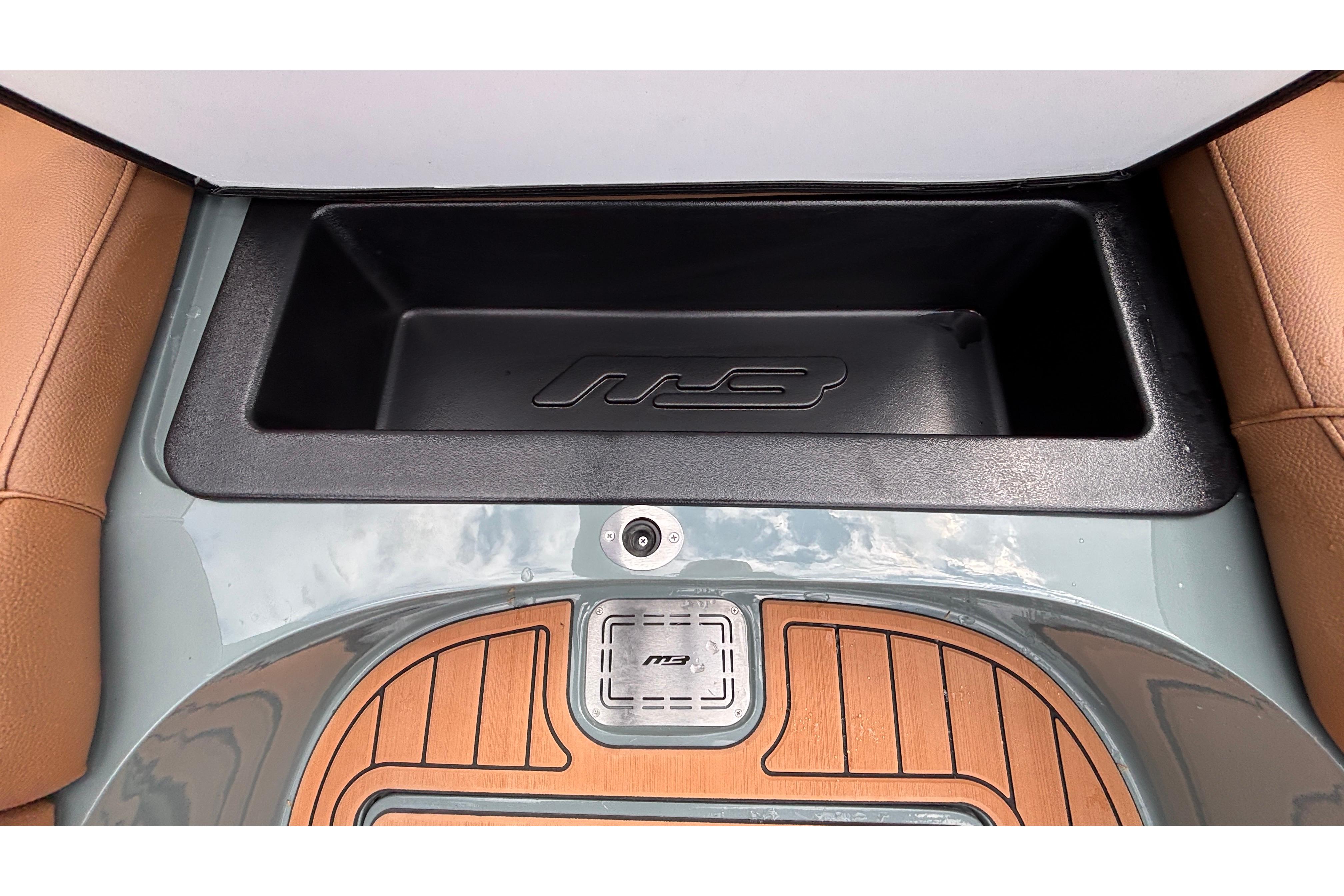 2026 MB B52 23 Classic interior storage compartment with wood accents and leather seating.