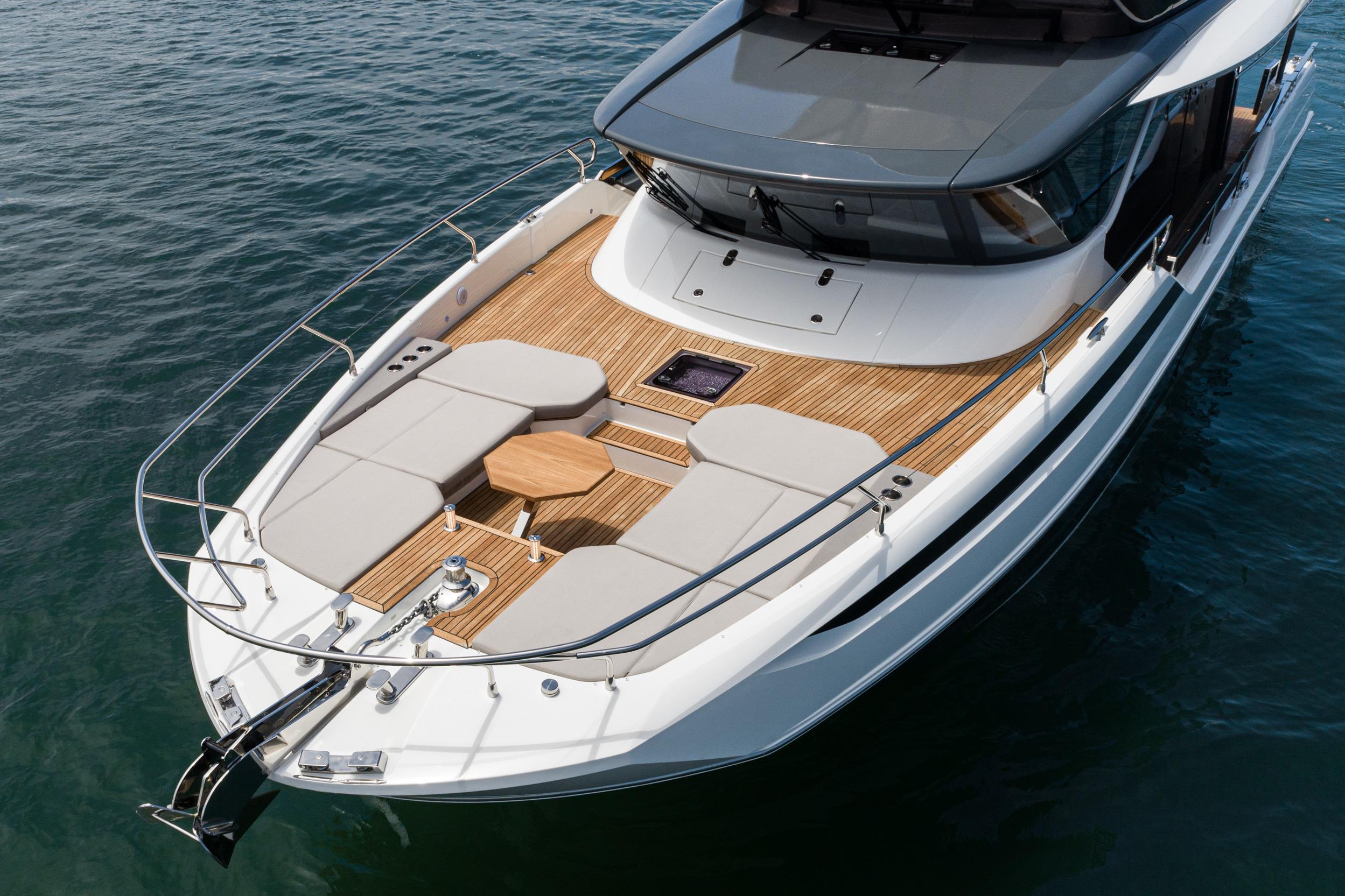 Luxurious 2024 Prestige X60 yacht with spacious deck and elegant design on calm waters.