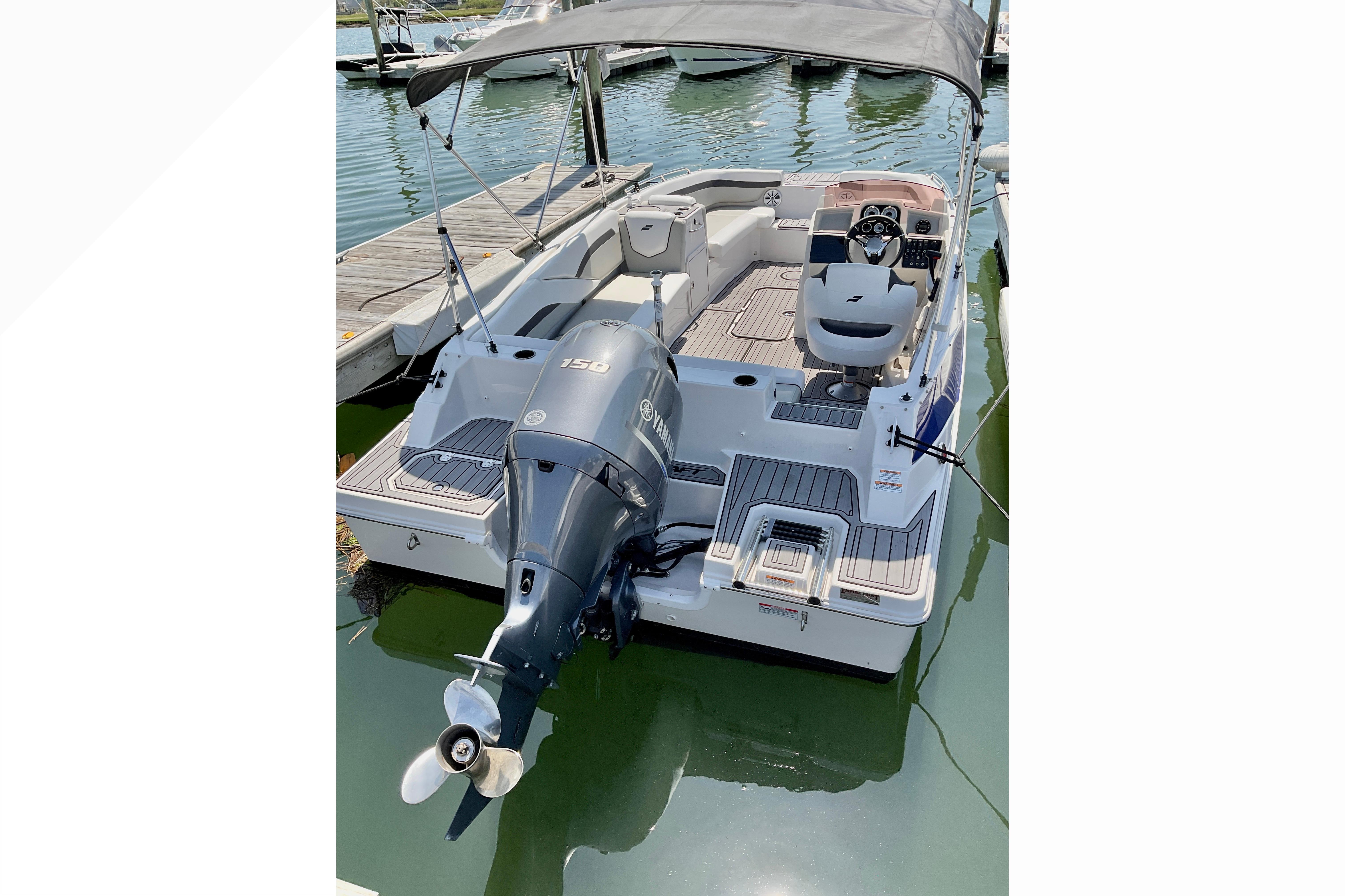 2023 Starcraft SVX 191 OB boat with Yamaha outboard motor, docked in marina.