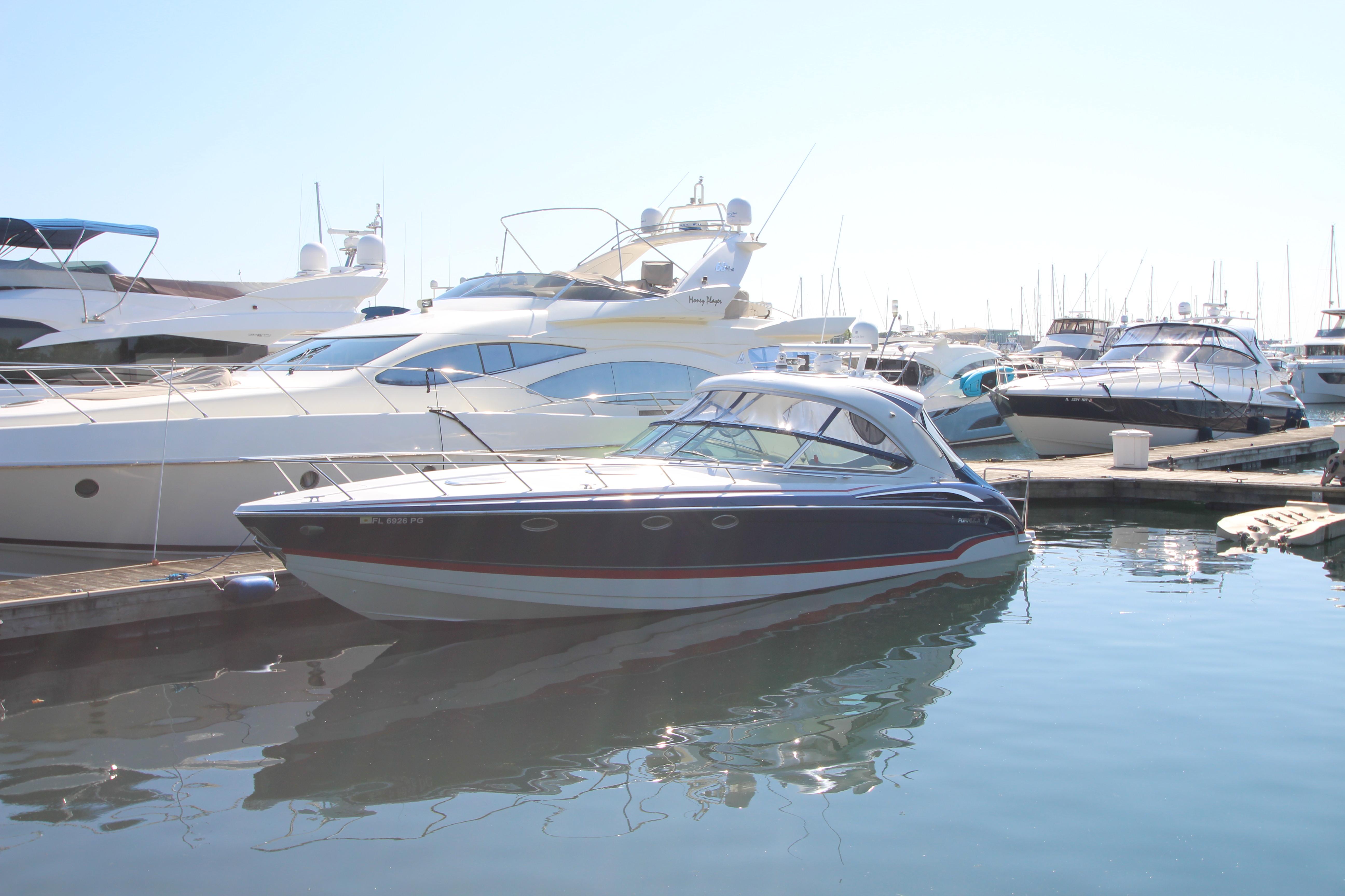 2012 Formula 400 Super Sport yacht docked at marina.