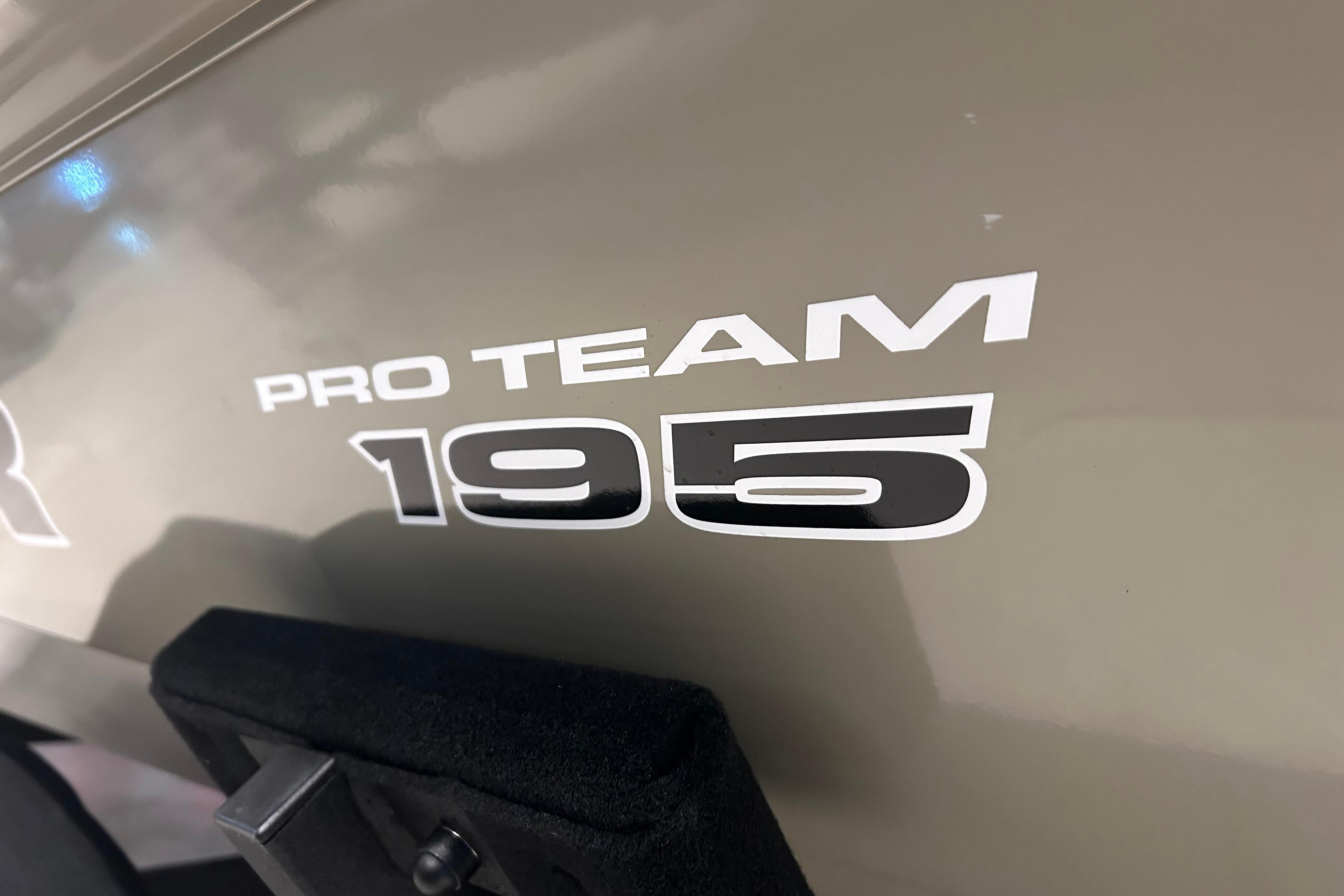 2026 Tracker Pro Team 195 boat logo on a sleek surface.