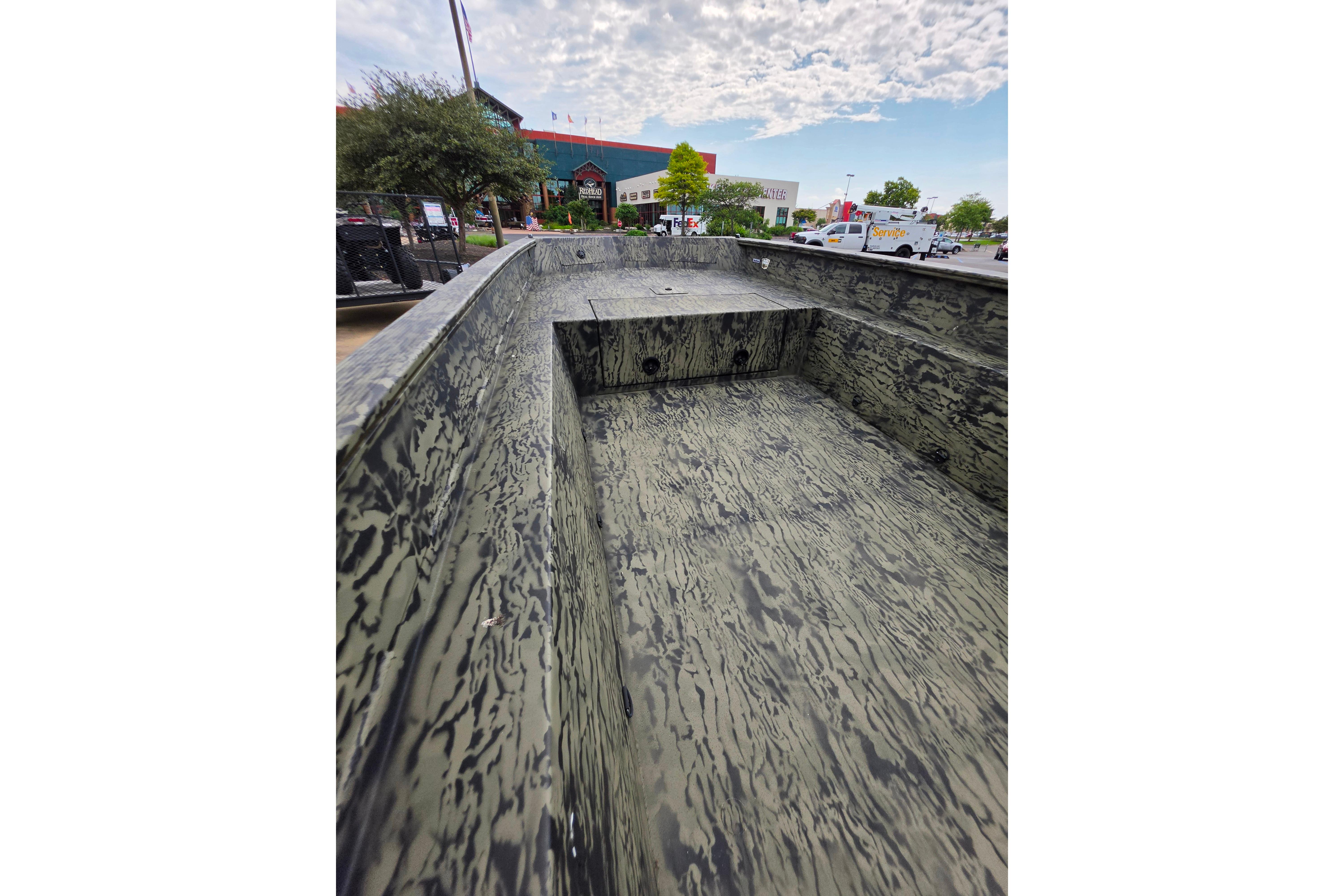 2026 Tracker Grizzly 1650 T Prairie Wings Edition boat with camouflage interior design.