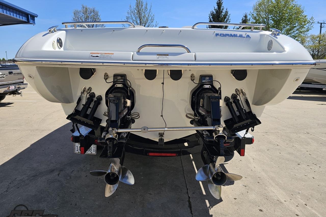 2014 Formula 292 FASTech boat rear view with dual propellers and outboard motors.