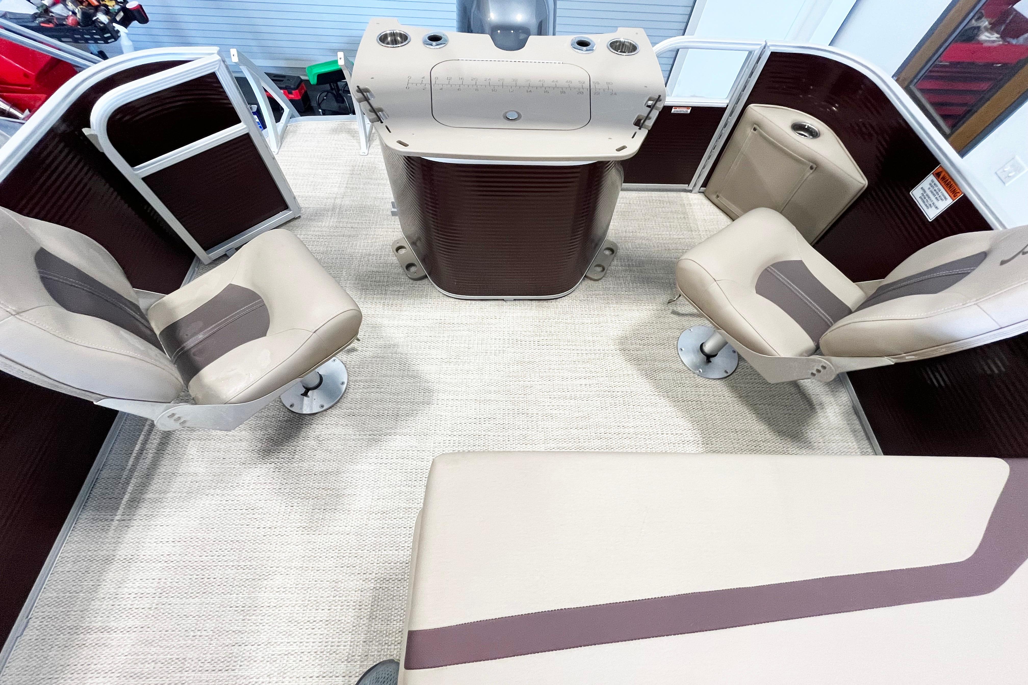 2020 Bennington SX25 boat interior with beige seating and helm station.