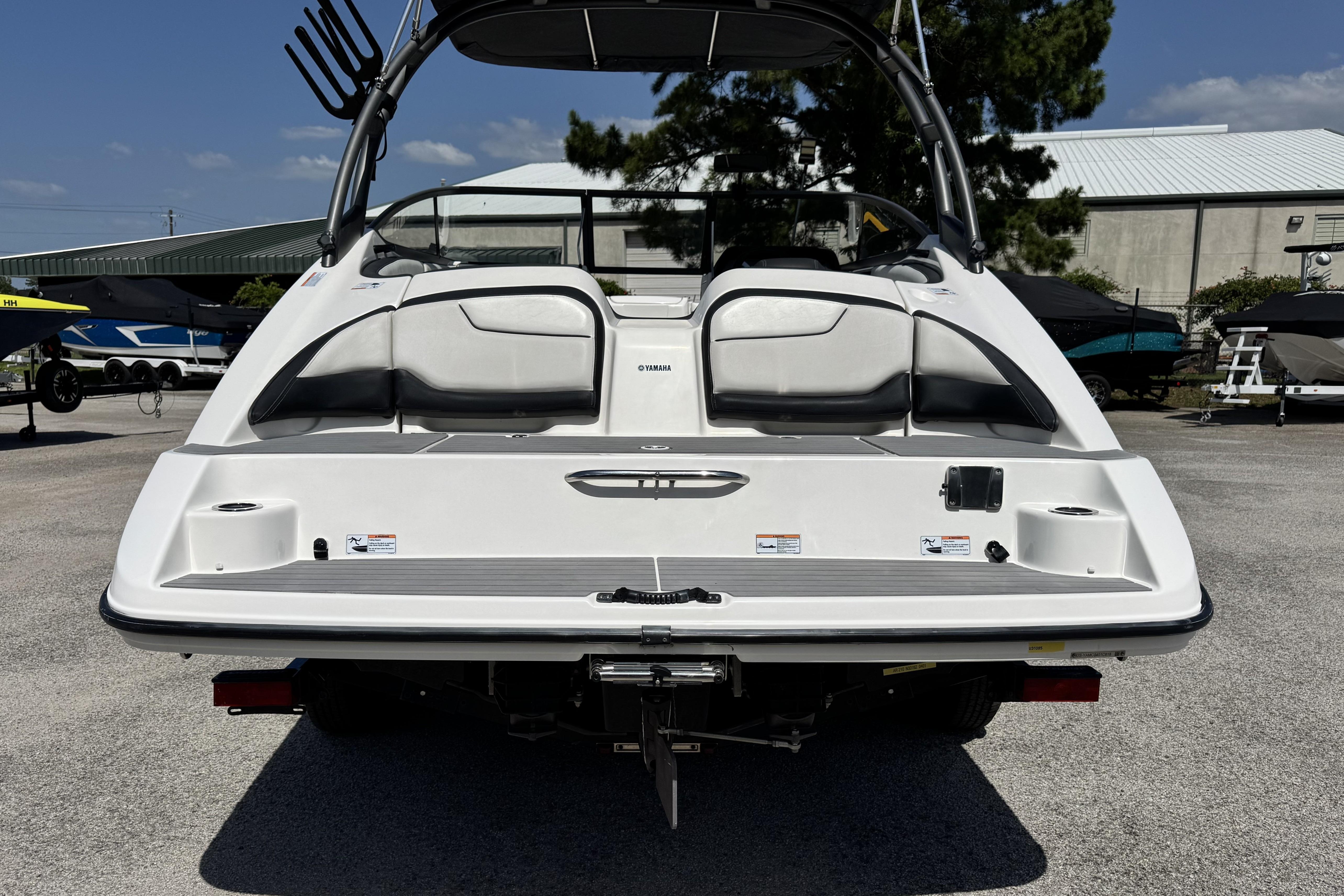 2018 Yamaha Boats AR210 rear view, showcasing sleek design and spacious seating.