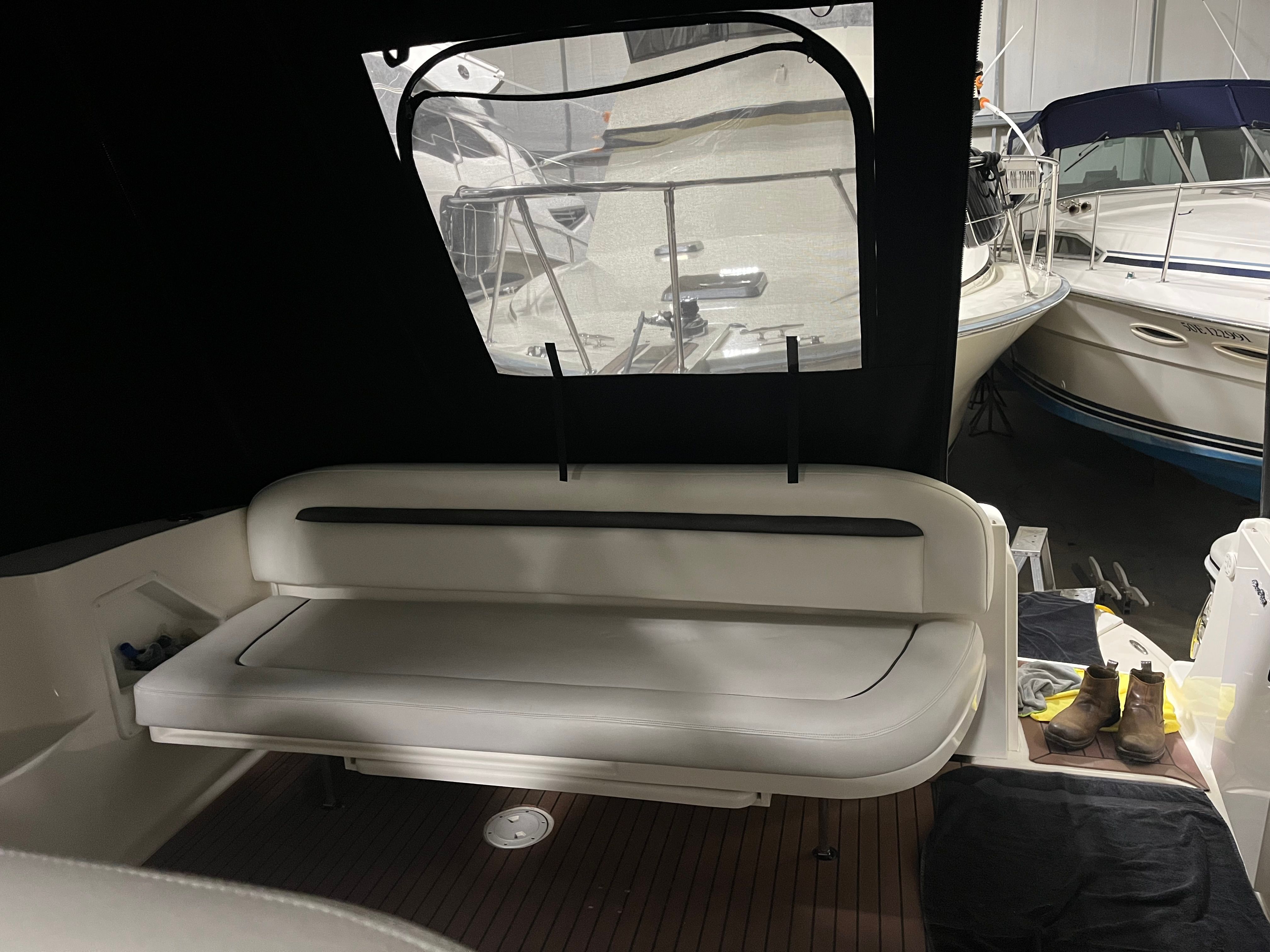 Interior of a 2005 Sea Ray Sundancer with seating area.