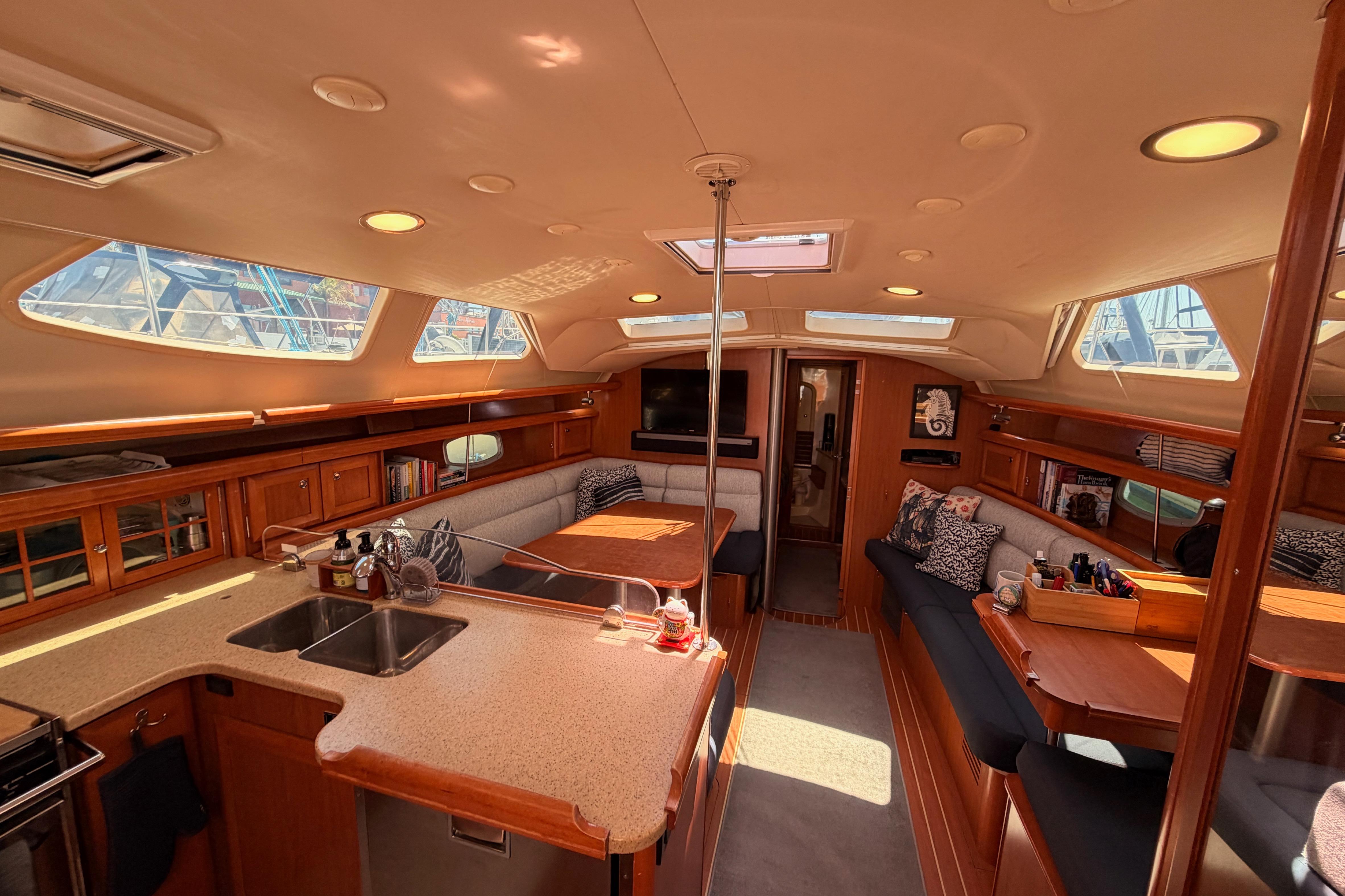 Luxurious interior of 2008 Hunter 45 Deck Salon yacht with spacious seating and modern amenities.