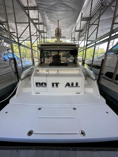2019 Tiara Yachts C53 docked in a covered marina.