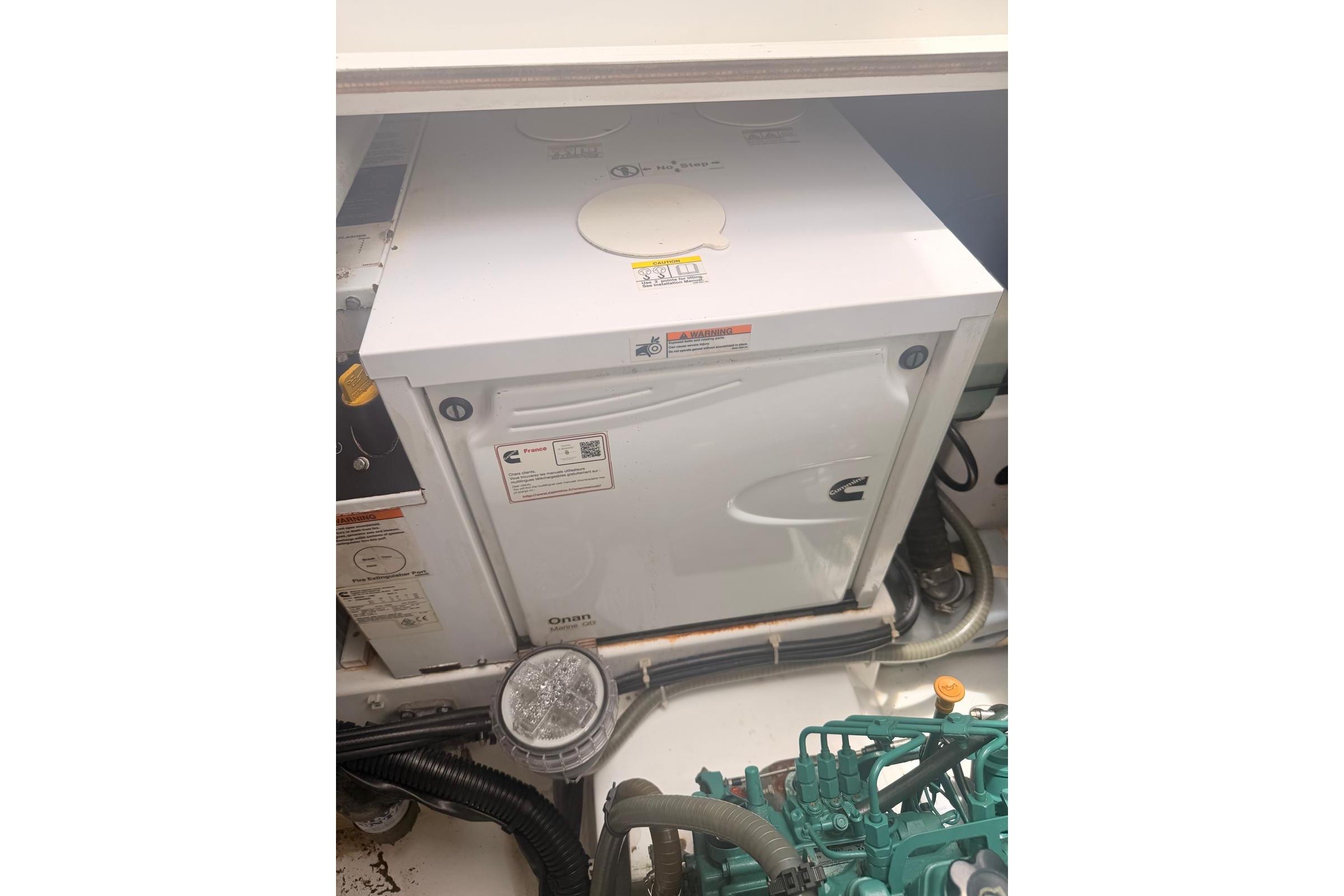 Engine compartment of 2018 Fountaine Pajot Lucia 40 catamaran with Cummins Onan generator.
