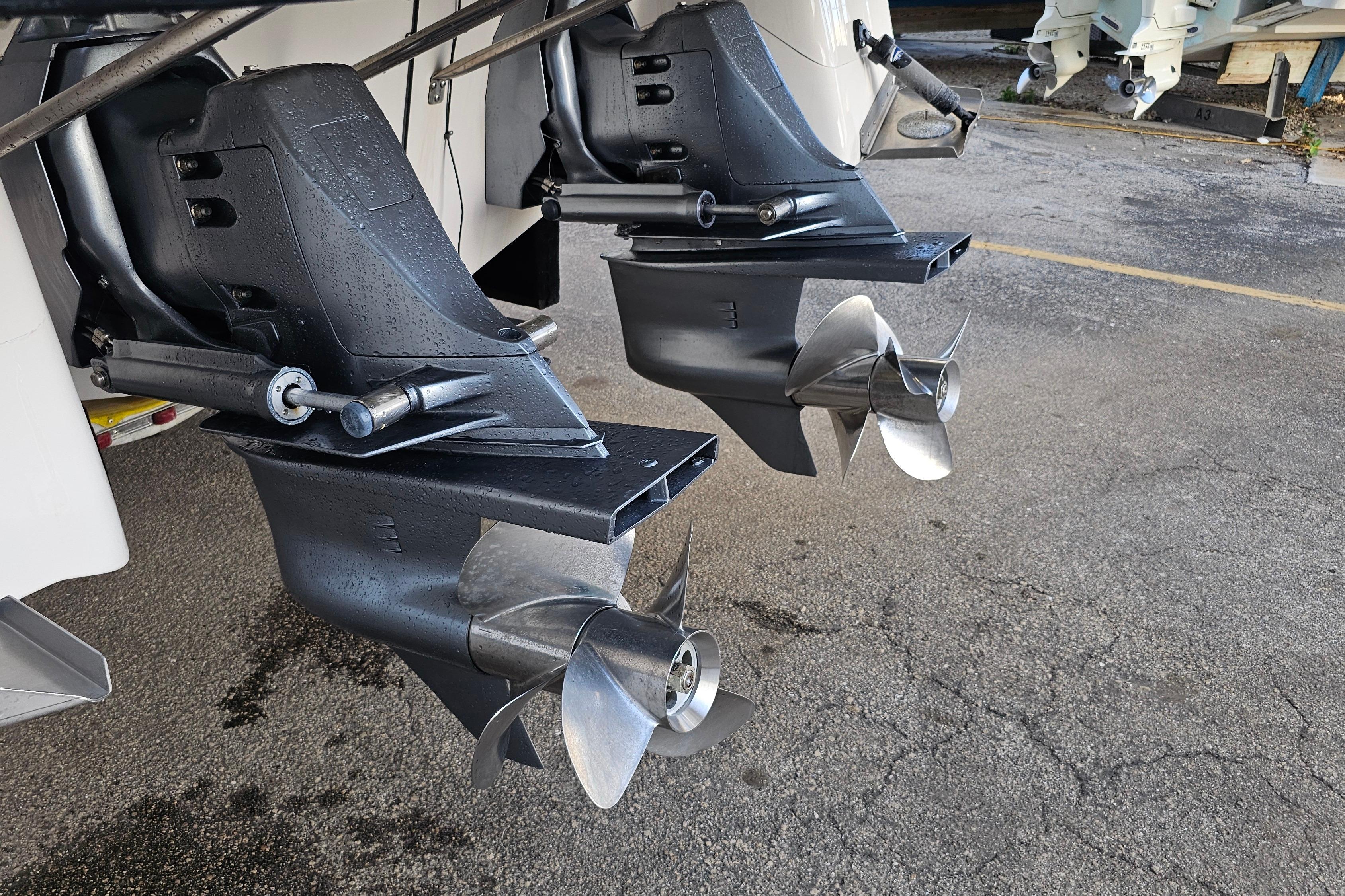 Twin propellers of a 2005 Regal 3060 Window Express boat on a dry dock.