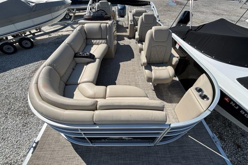 2014 Bennington 2575 RCW pontoon boat with spacious seating and modern interior design.