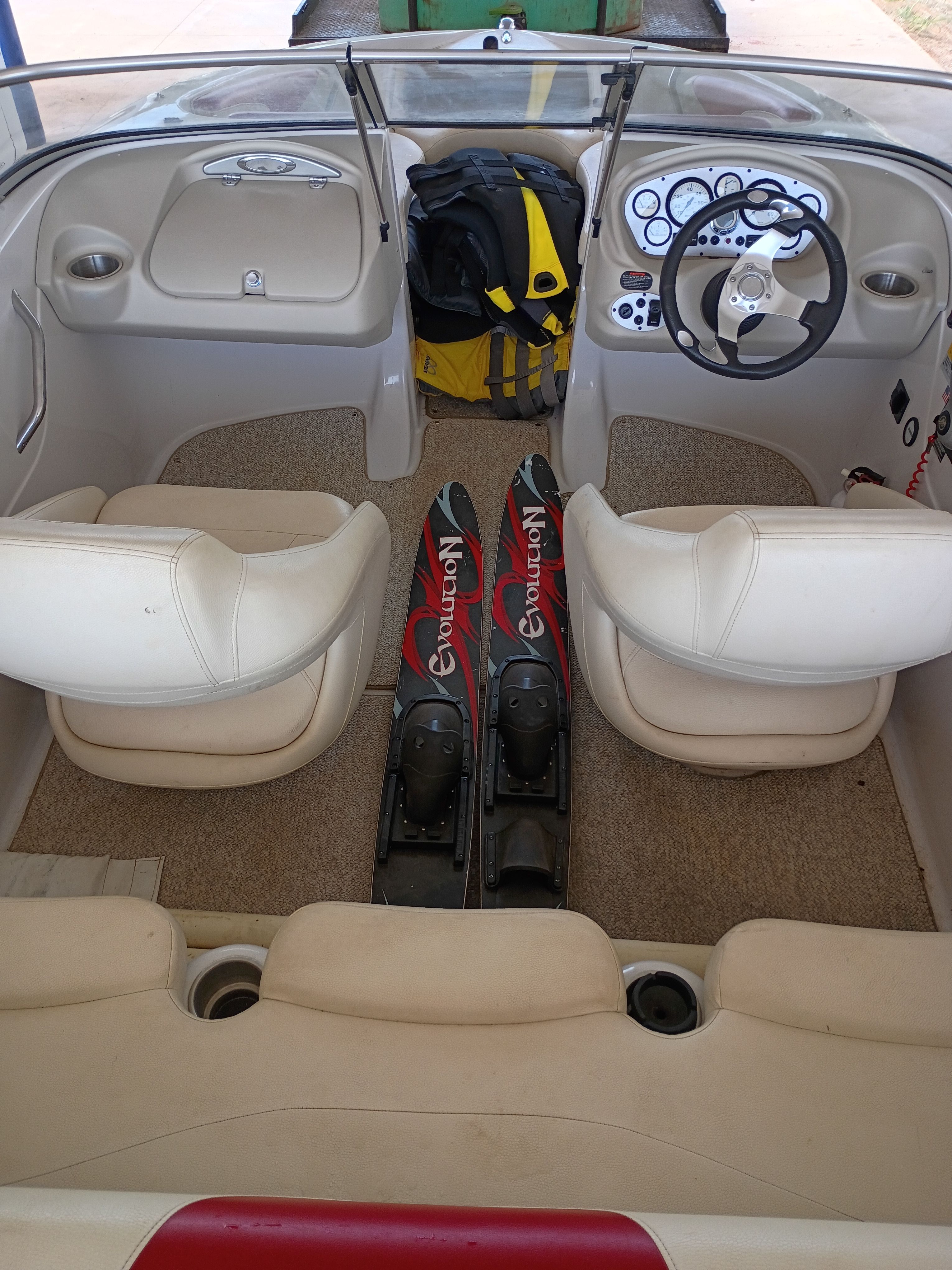 Interior of a 2010 Glastron MX 185 boat with water skis.