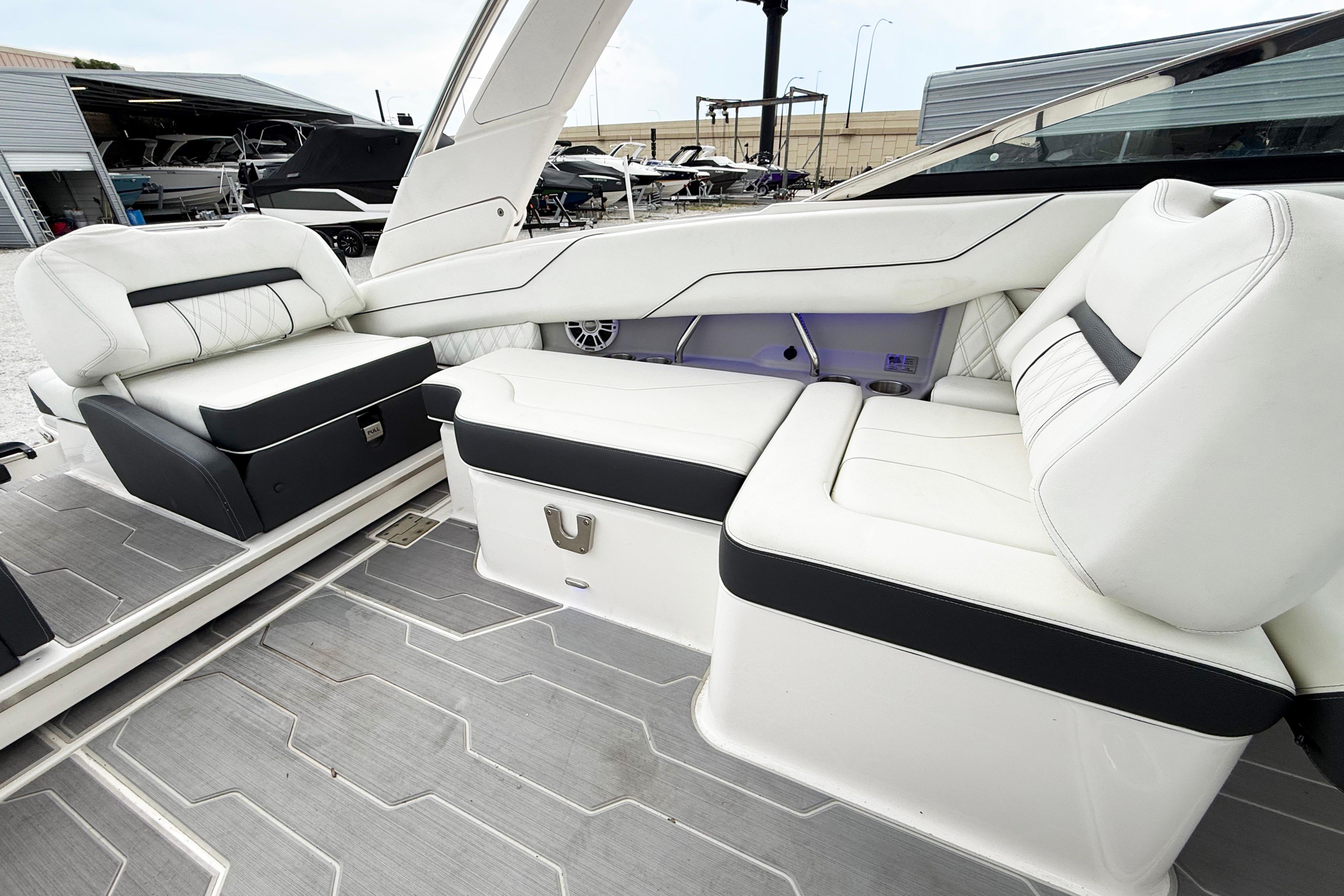 Luxurious interior of 2024 Regal LX4 boat with white and black seating.
