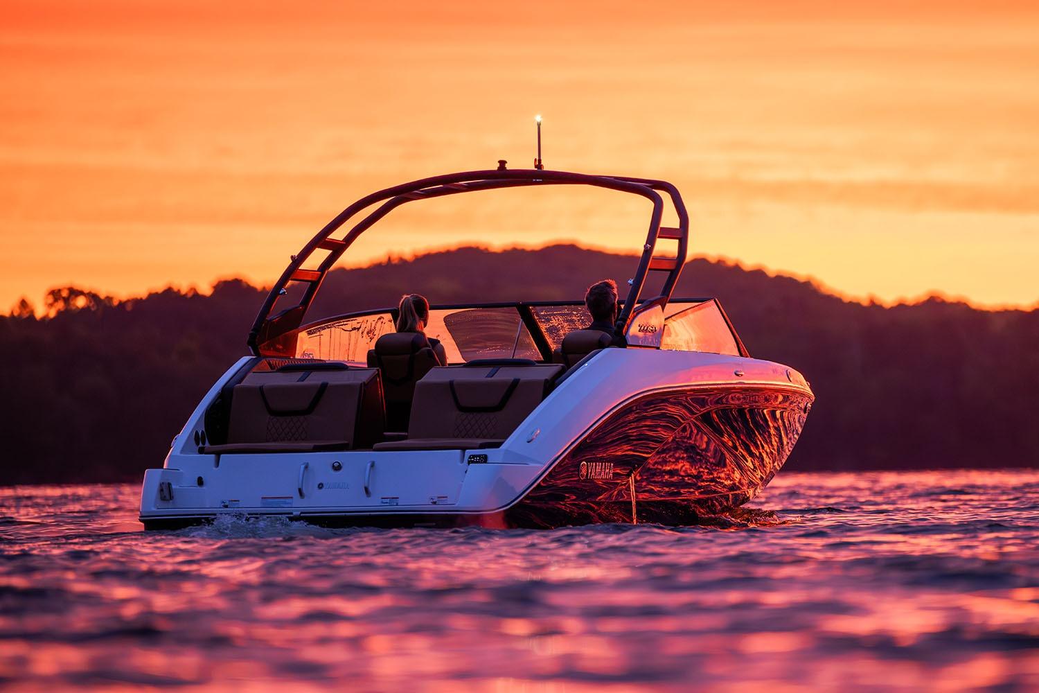 Manufacturer Provided Image: 2026 Yamaha Boats 222SE cruising at sunset on a serene lake.