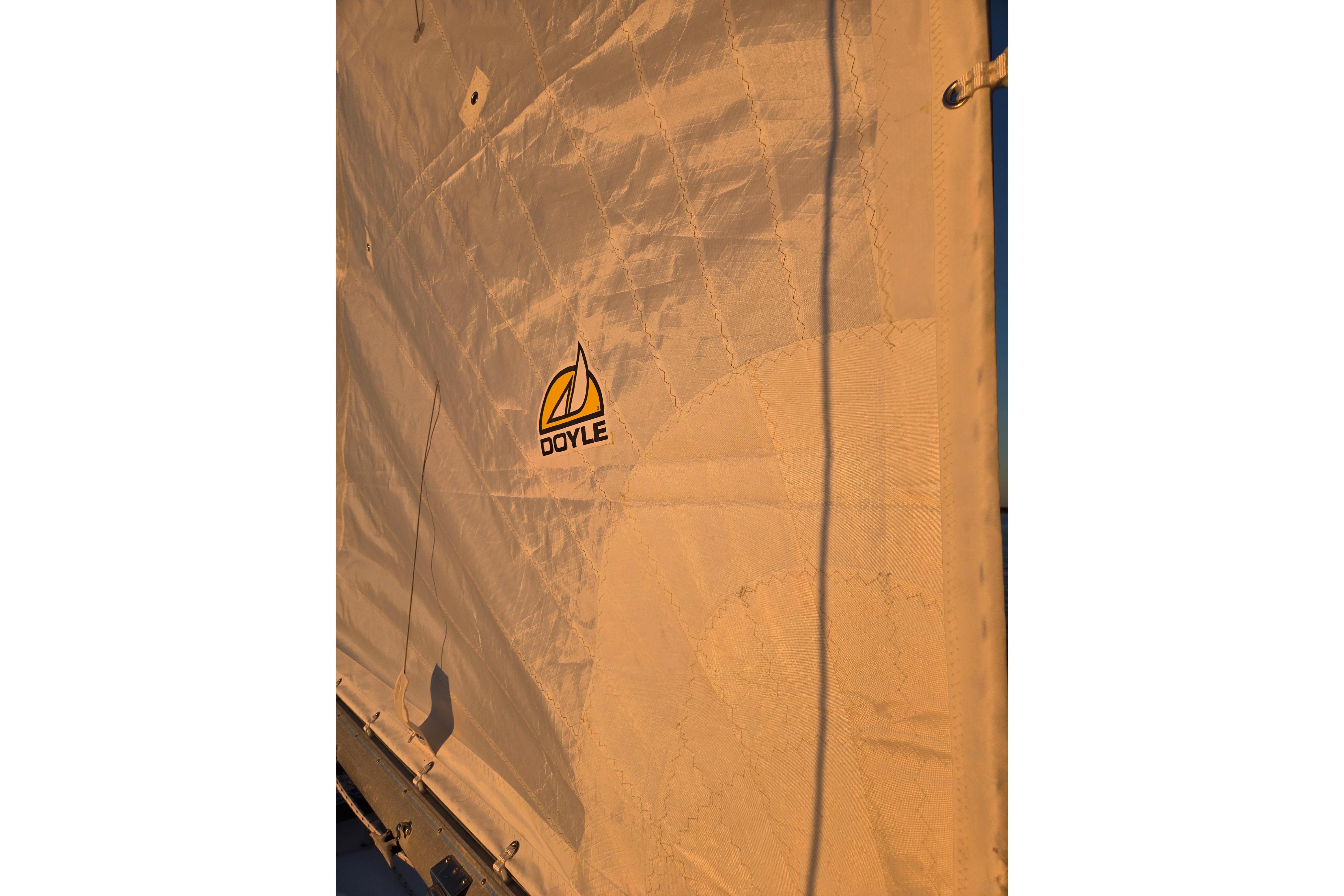 Sail of a 1970 Hinckley Bermuda 40 with Doyle logo, sunlit fabric.
