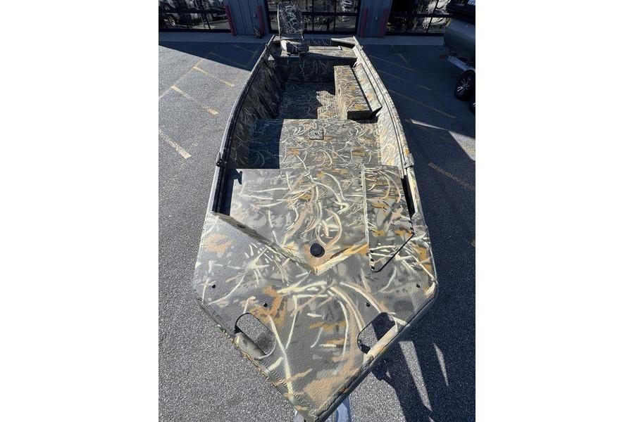2026 War Eagle 648LDV boat with camouflage design, parked outdoors.