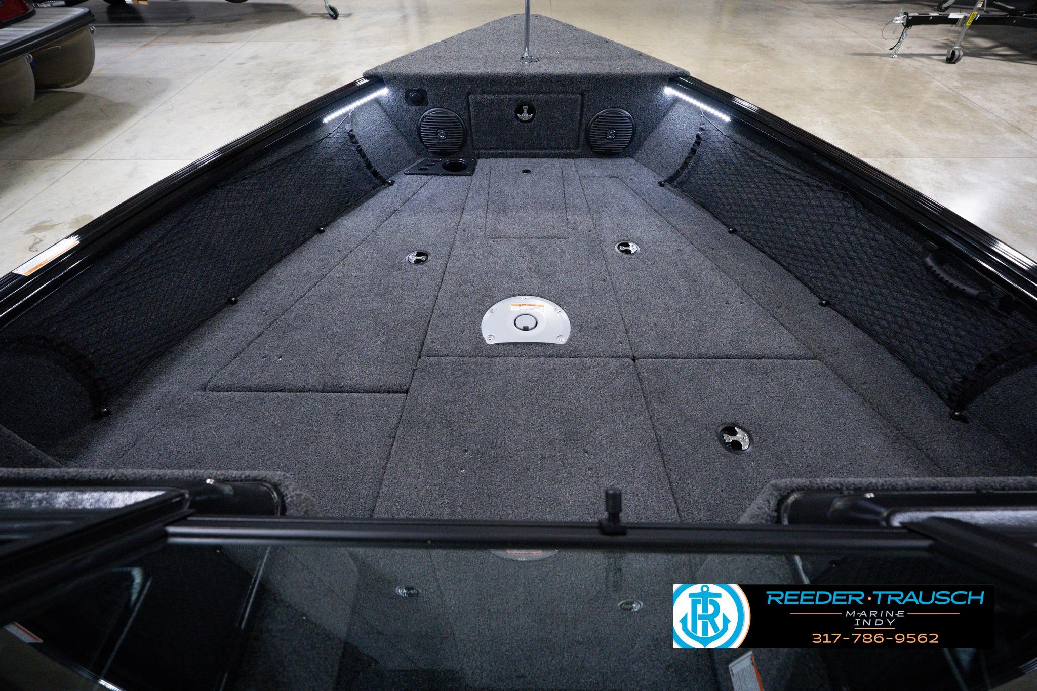 2026 Lund 1875 Impact XS SS boat interior with spacious carpeted deck.