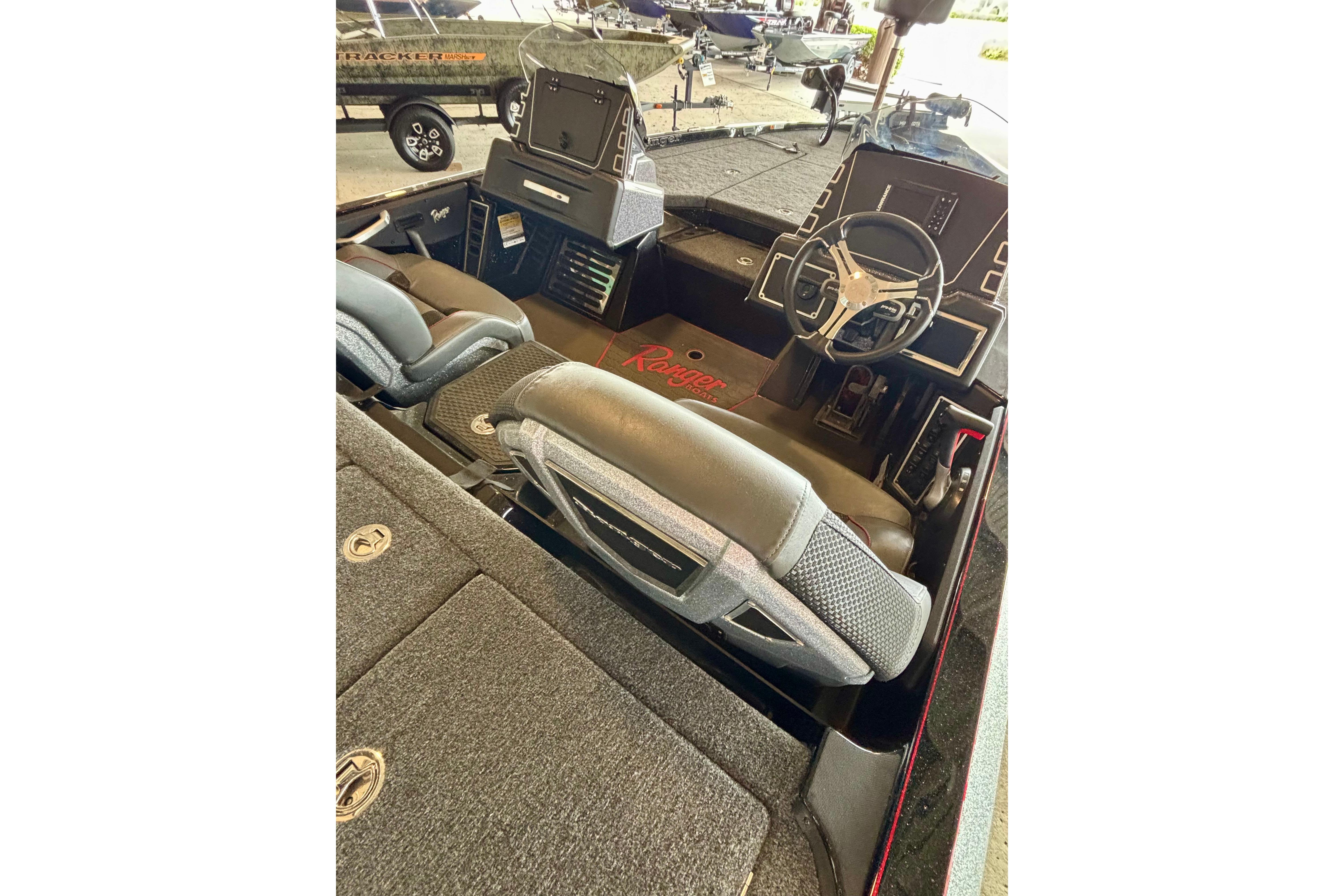 Interior of 2025 Ranger Z519R boat with steering wheel and seating.