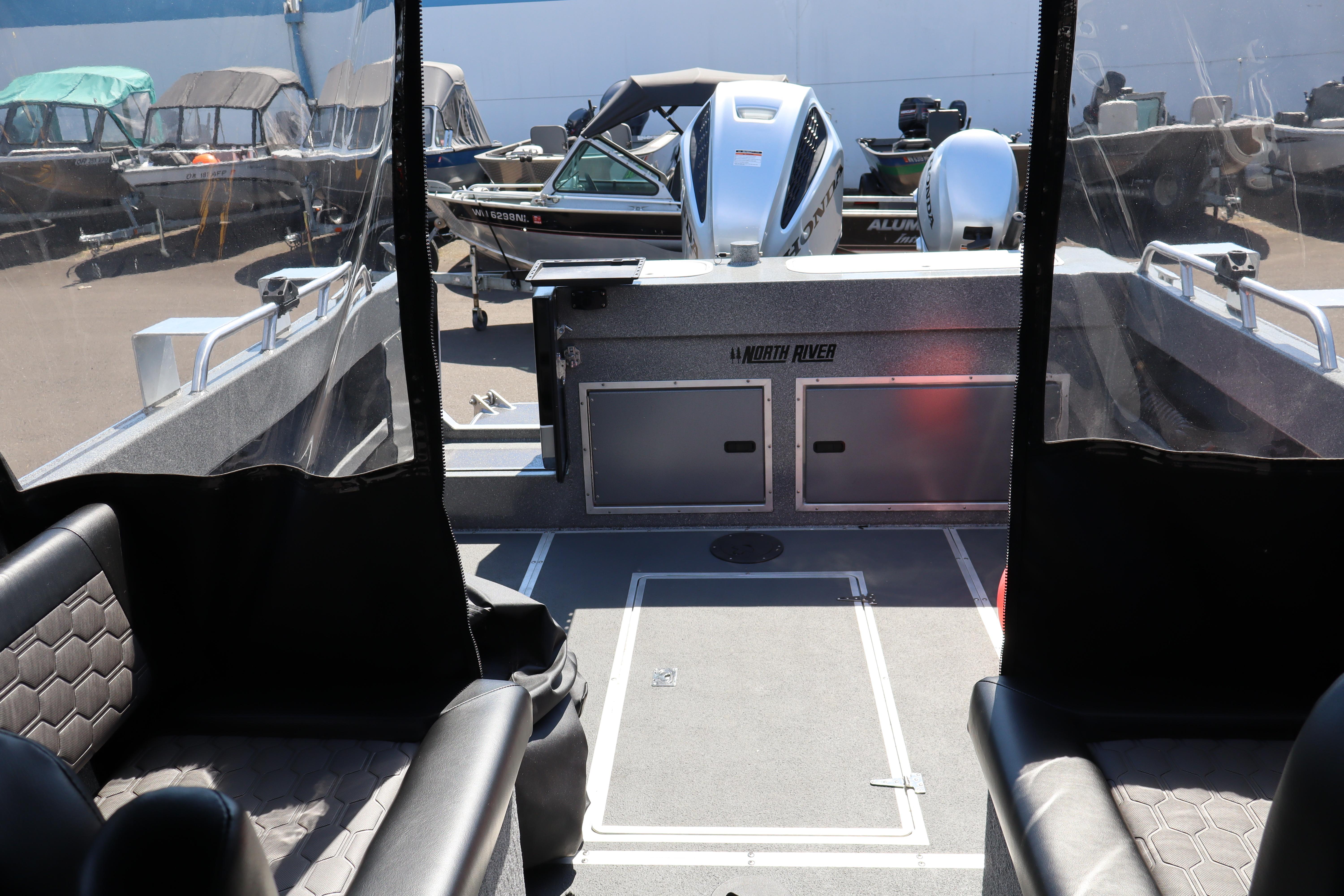 Interior view of 2025 NorthRiver SEAHAWK boat, showcasing seating and storage compartments.