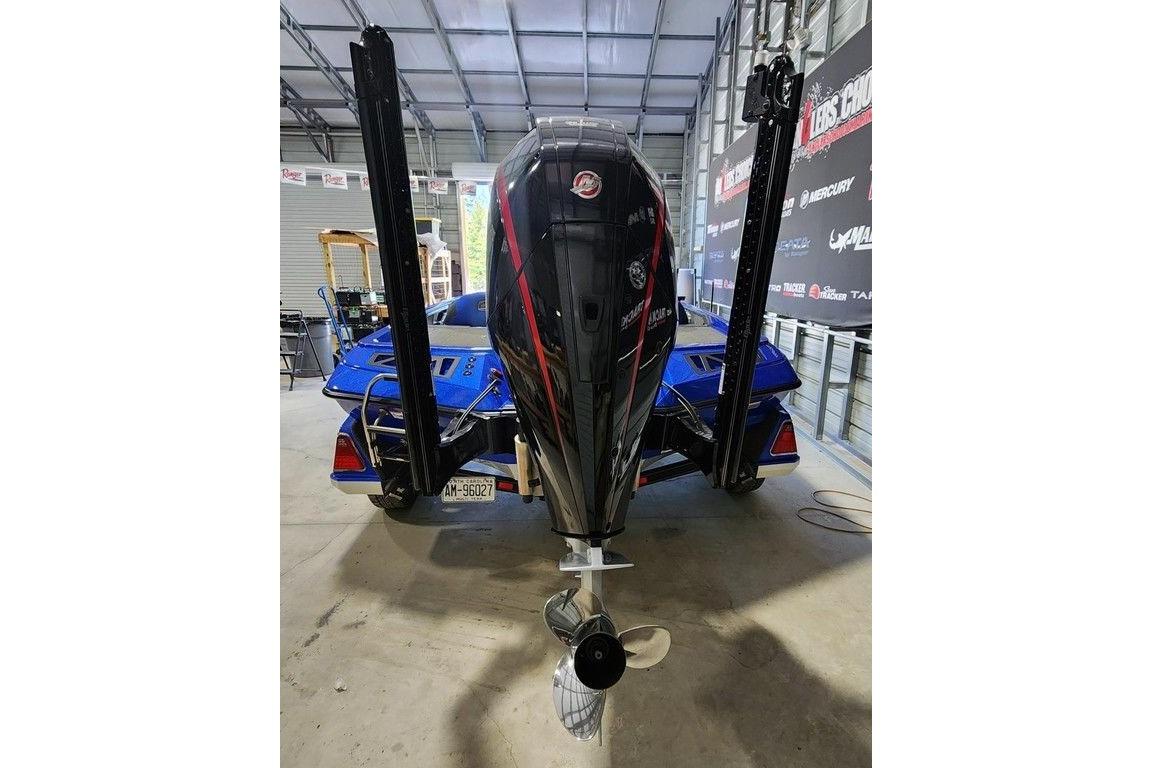 2022 Ranger Z519 Cup-Equipped boat in a garage, showcasing powerful outboard motor.