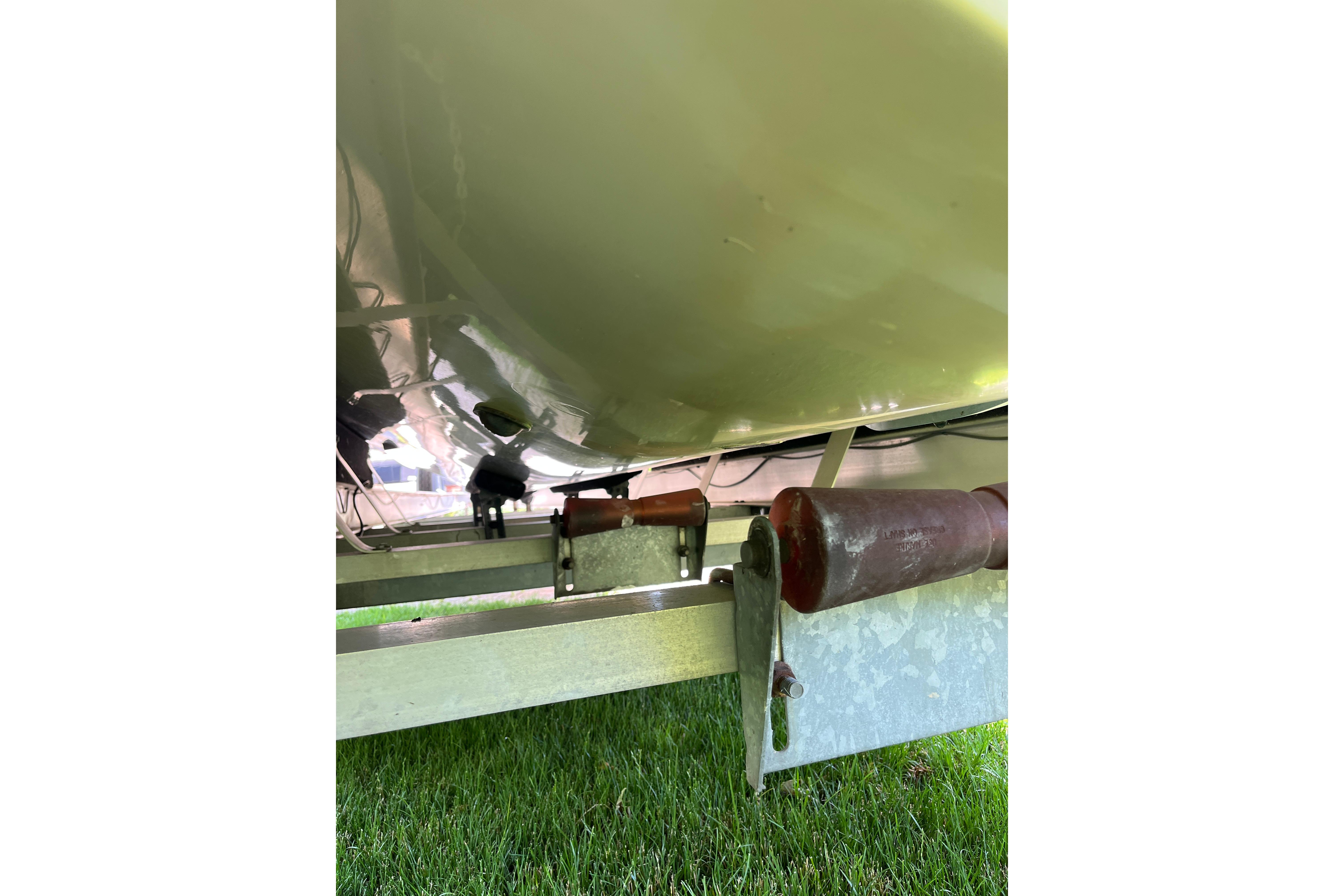 Underneath view of a 1994 Intrepid 30 Open Cuddy boat on a trailer.