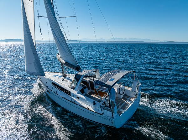 2021 Beneteau Oceanis 38.1 sailboat cruising on open sea.
