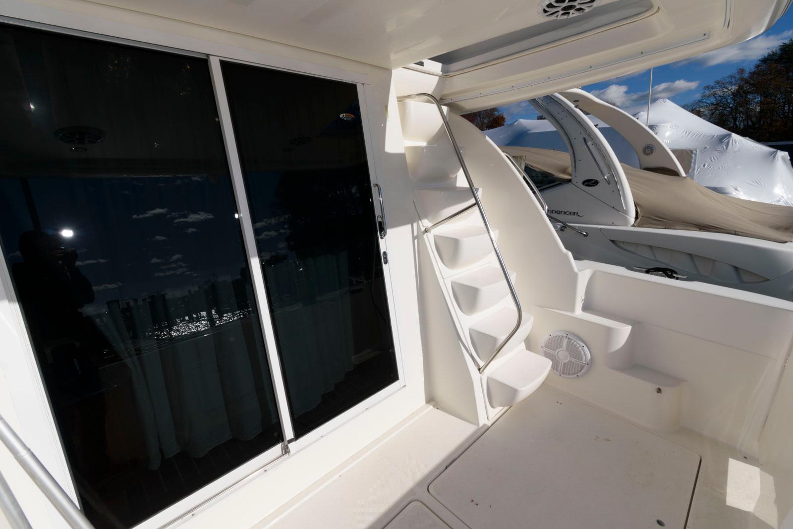 2003 Meridian 381 Sedan yacht interior with stairs and sliding glass door.
