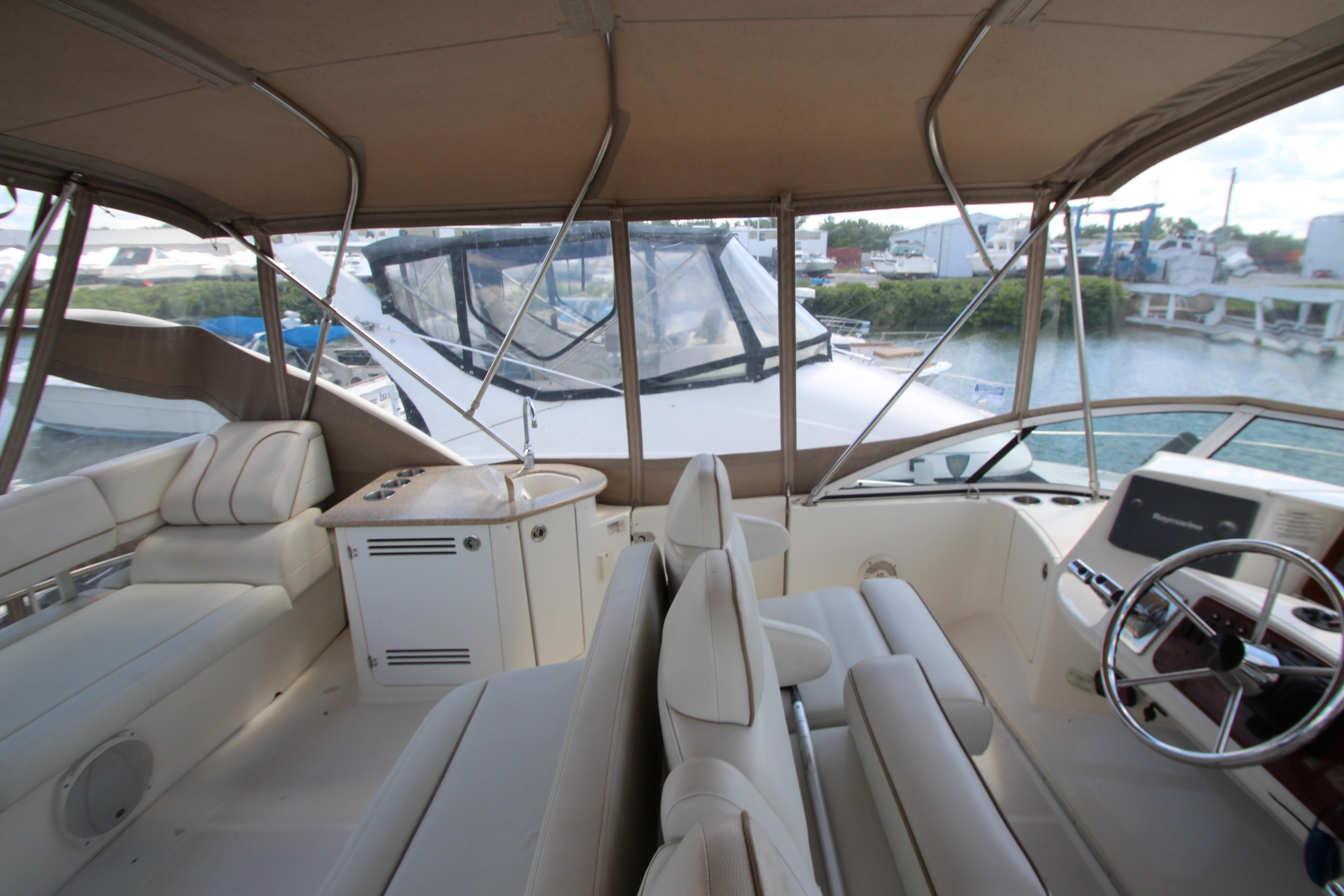 Interior view of 2006 Silverton 38 Sport Bridge yacht with luxurious seating and helm.